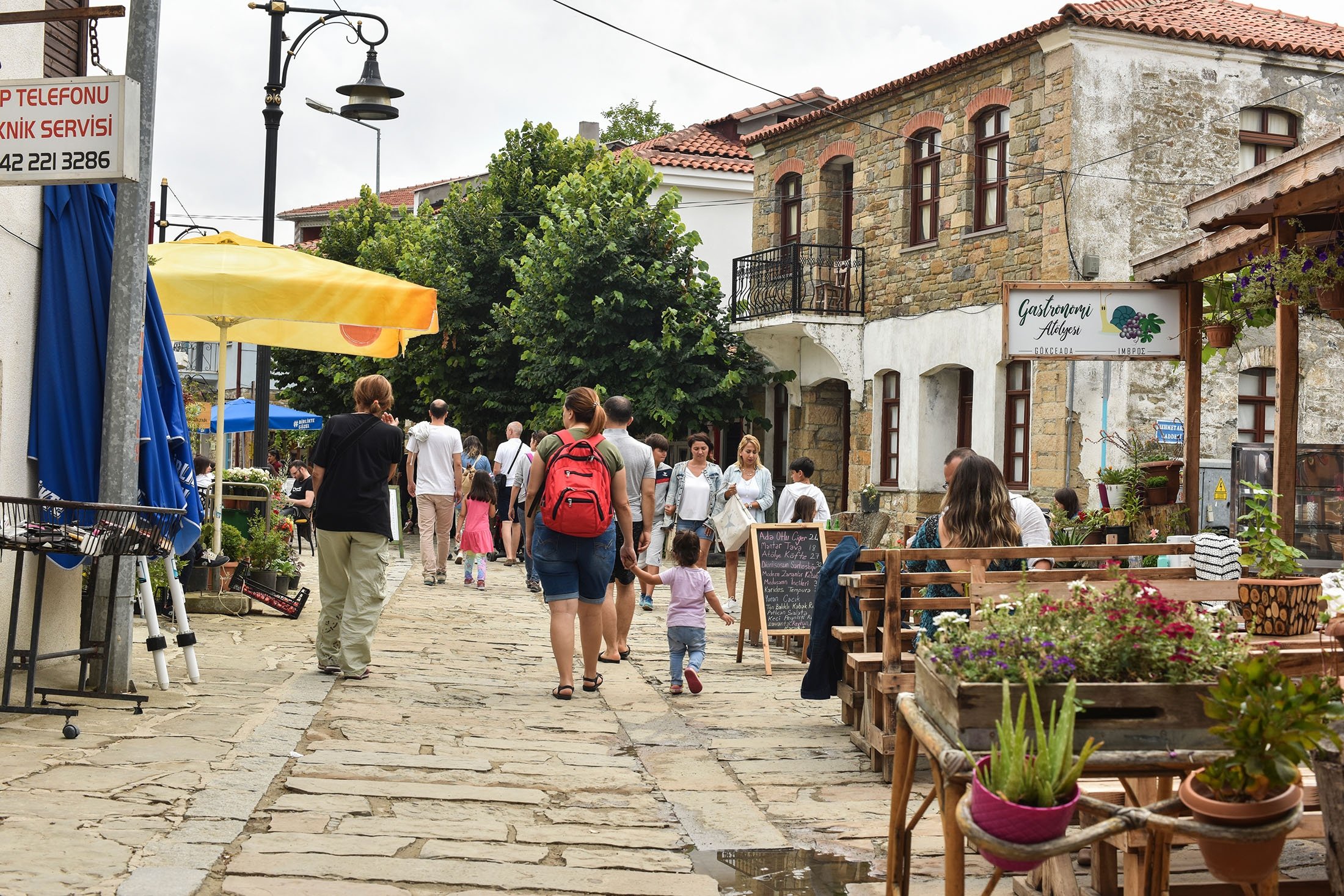 280857 Tourists wander the city center at Gökçeada, in Çanakkale, Türkiye, July 15, 2019. (Shutterstock Photo)