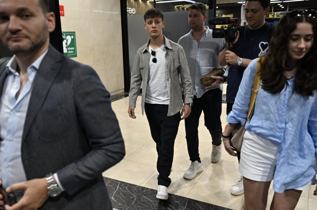 Real Madrid's Arda Güler (C) arrives at the Barajas Adolfo Suarez with his entourage ahead of his unveiling, Madrid, Spain, July 7, 2023. (AA Photo)