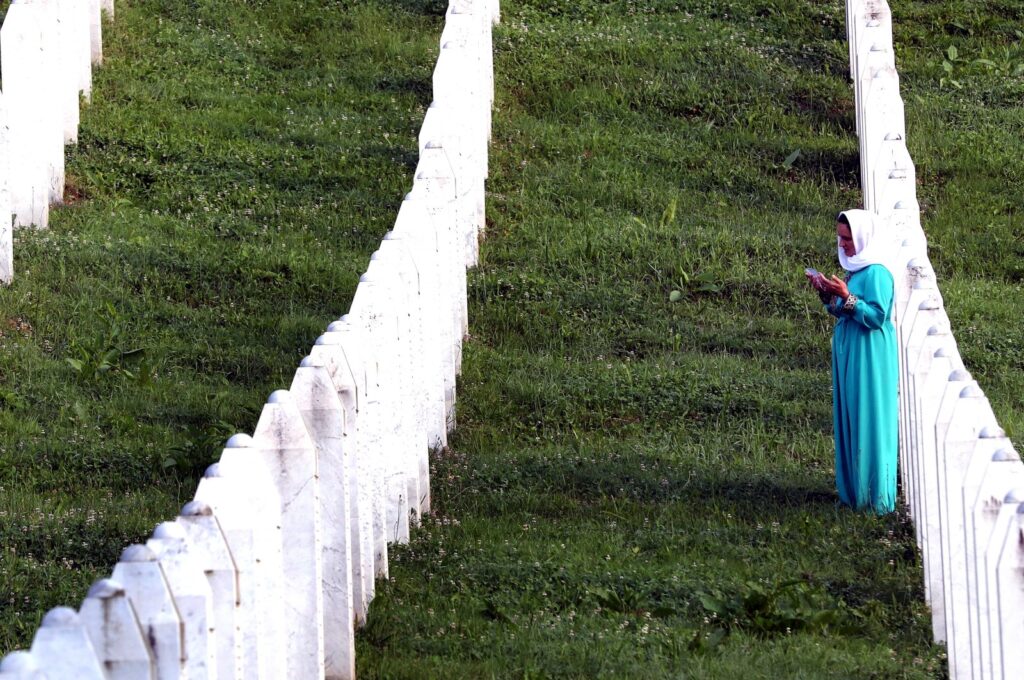 A Bosnian Muslim woman prays during a funeral ceremony for 30 newly-identified Bosnian Muslim victims, in Srebrenica, Bosnia and Herzegovina, July 11, 2023. (EPA Photo)