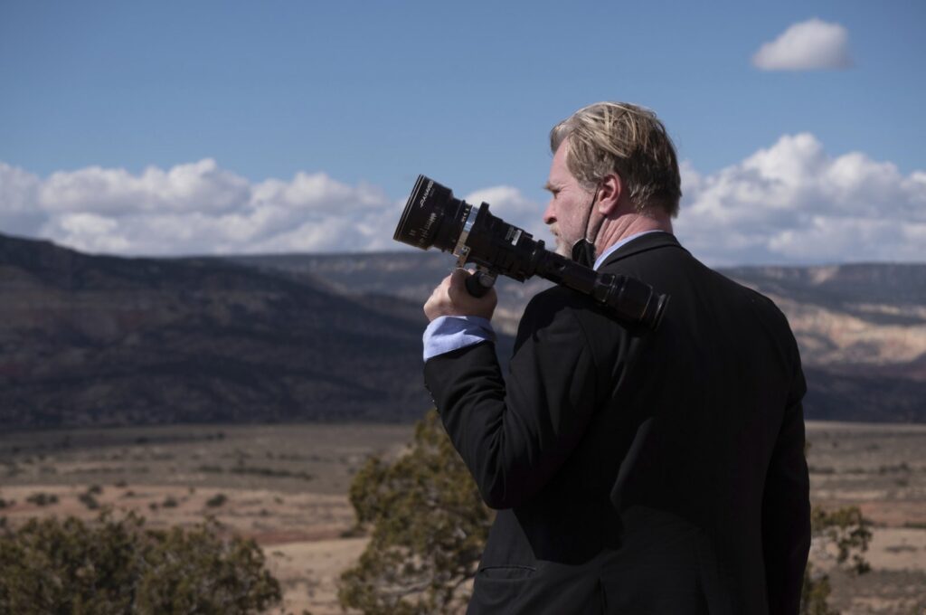 This image released by Universal Pictures shows filmmaker Christopher Nolan on the set of "Oppenheimer." (AP Photo)