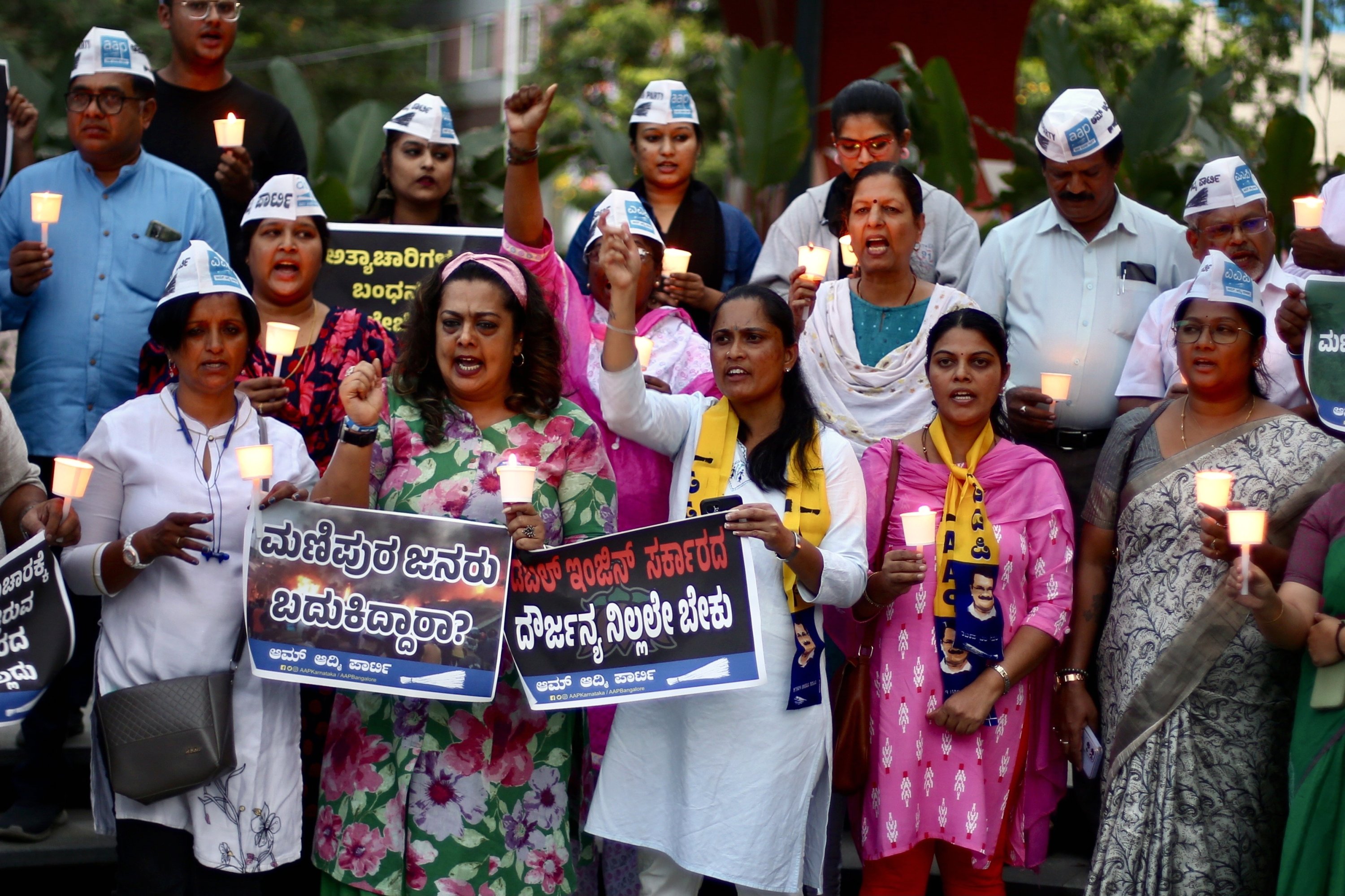283628 Members of the Aam Aadmi Party hold candles during a candlelight vigil to protest against the ongoing violence against women in Manipur state, Bangalore, India, July 20, 2023. (EPA Photo)