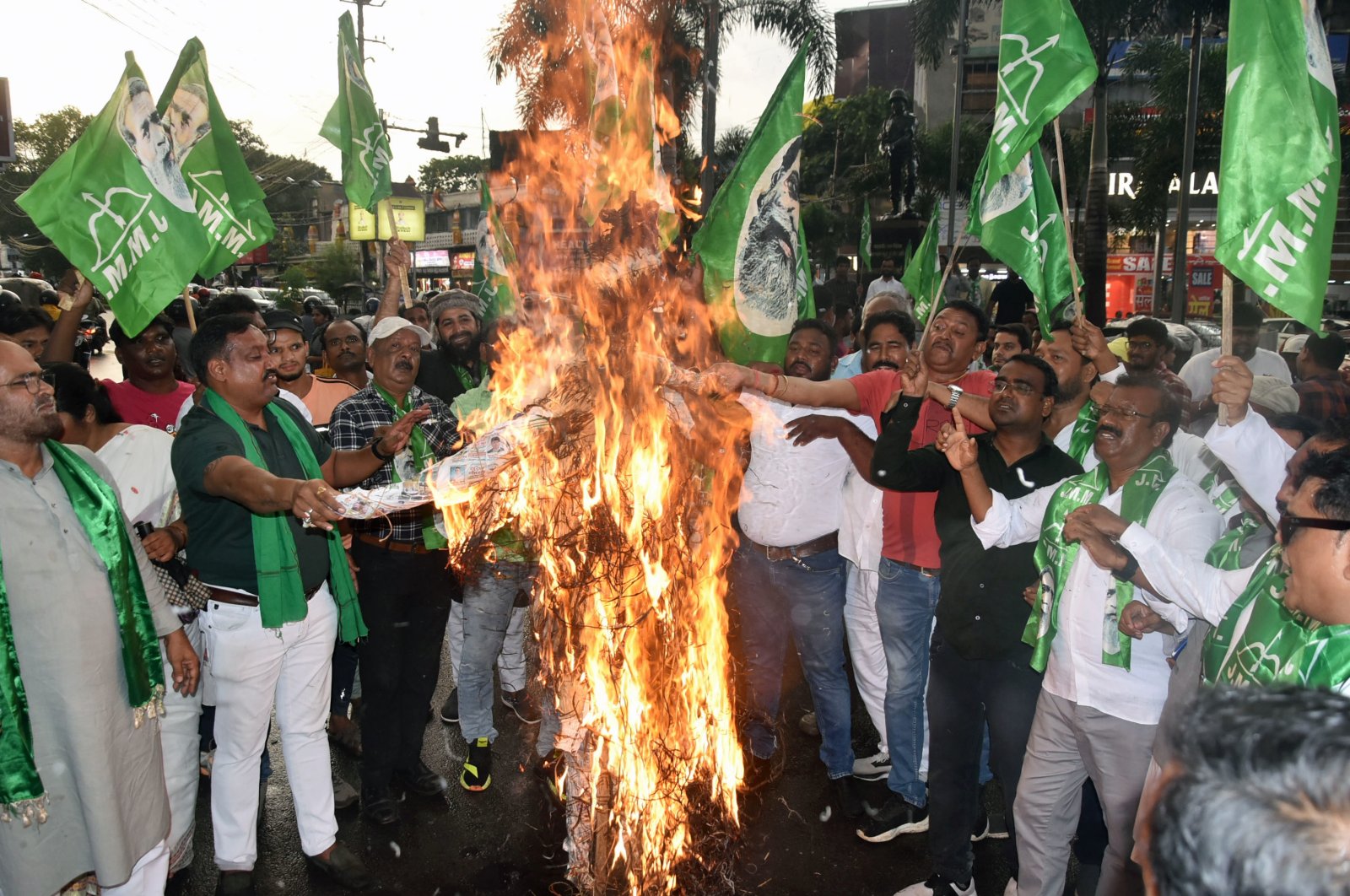 Jharkhand Mukhti Morcha (JMM) supporters burn an effigy during a protest over two women being allegedly raped and paraded naked in Manipur, at Albert Ekka Chowk, Ranchi, India, July 20, 2023. (Reuters Photo)