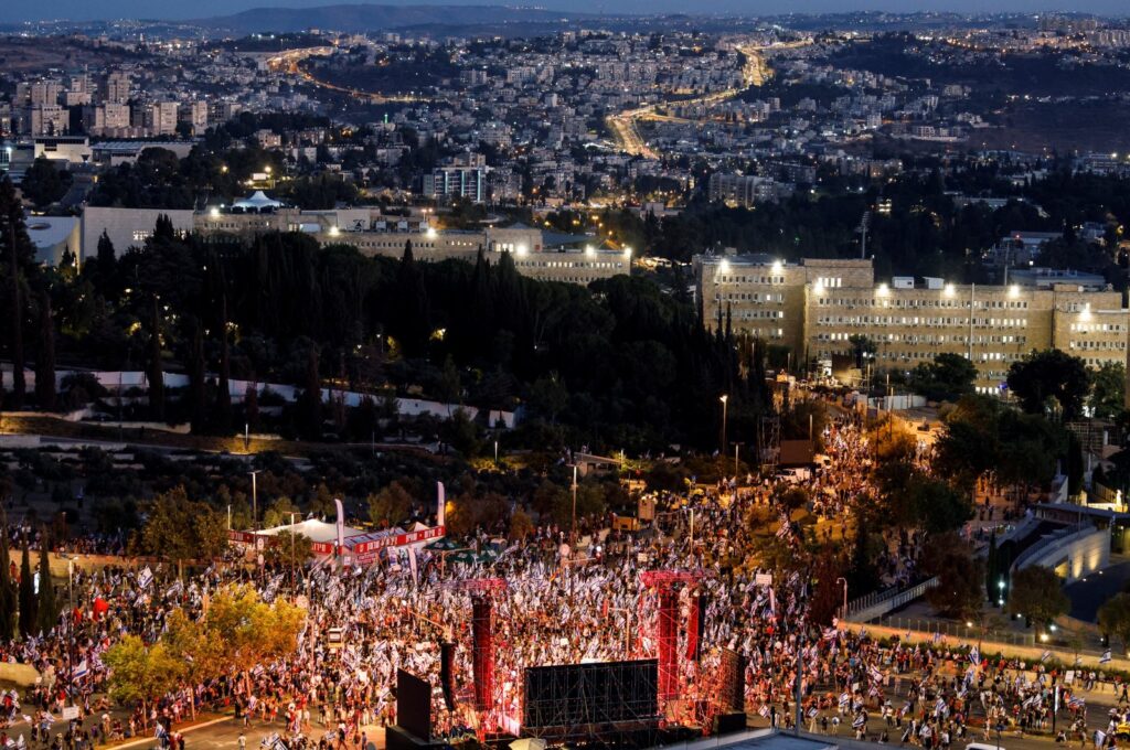Protesters hold Israeli flags as they demonstrate following a parliament vote on a contested bill that limits Supreme Court powers to void some government decisions, near the Knesset, West Jerusalem, Israel, July 24, 2023. (Reuters Photo)