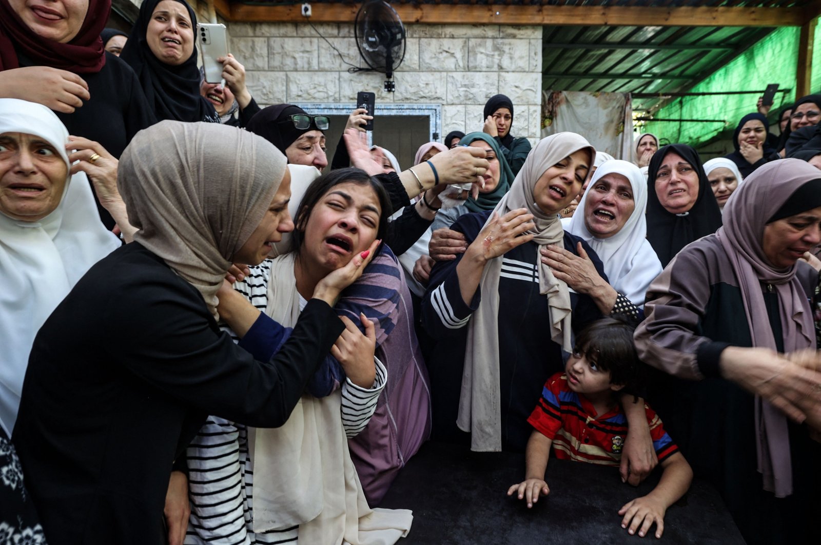 Mourners react during the funeral of Mahmoud Abu Saan in the occupied West Bank town of Tulkarm, Palestine, Aug. 4, 2023. (AFP Photo)