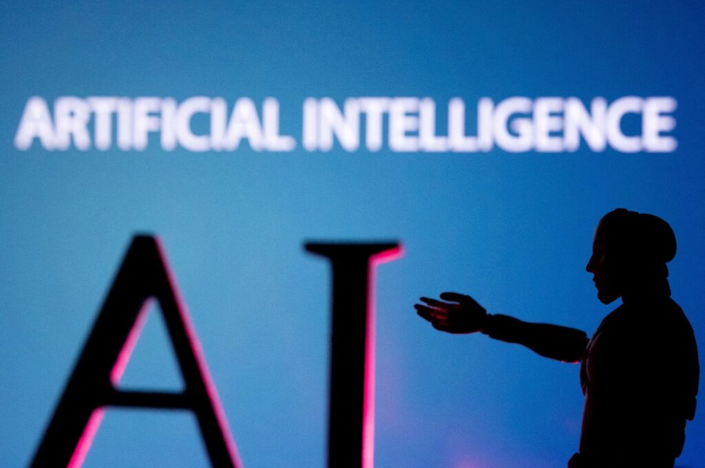 Artificial intelligence letters and robot miniature are seen in this illustration photo, June 23, 2023. (Reuters Photo)