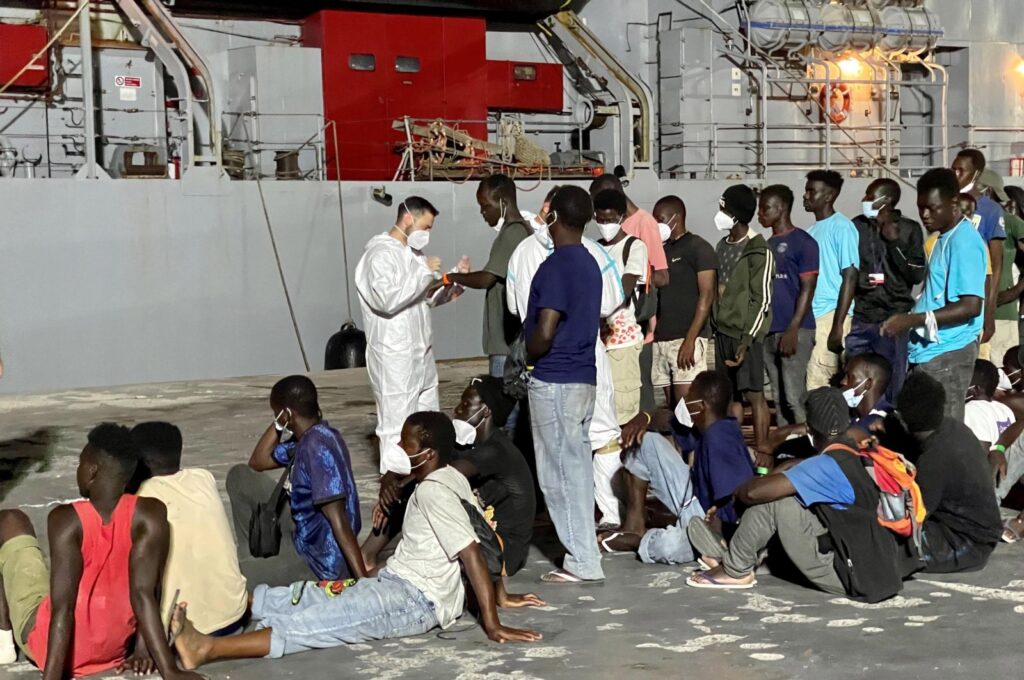 Around 700 migrants wait to board an Italian Navy ship to be taken to Messina and Calabria, Lampedua, Italy, July 18, 2023. (EPA Photo)