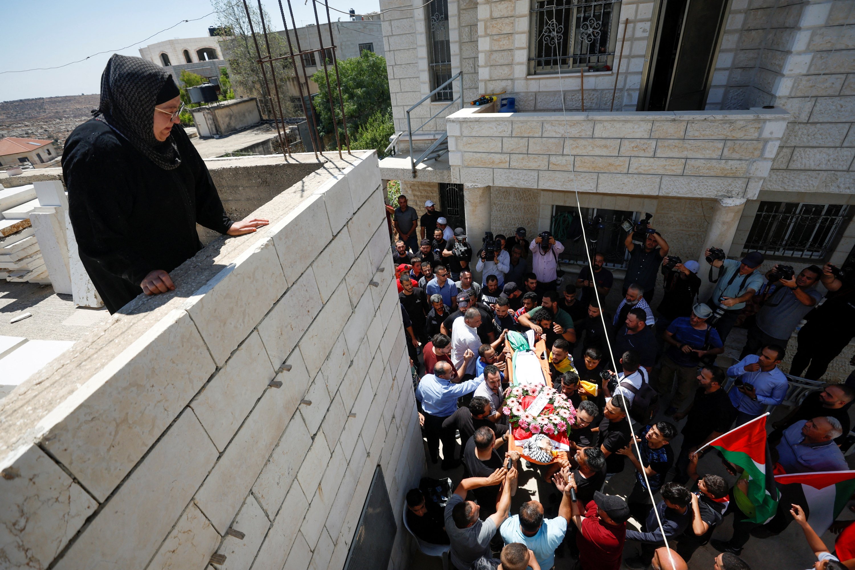 286230 Mourners carry the body of a Palestinian who was killed by Israeli settlers, Israeli-occupied West Bank, Palestine, Aug. 5, 2023. (Reuters Photo)