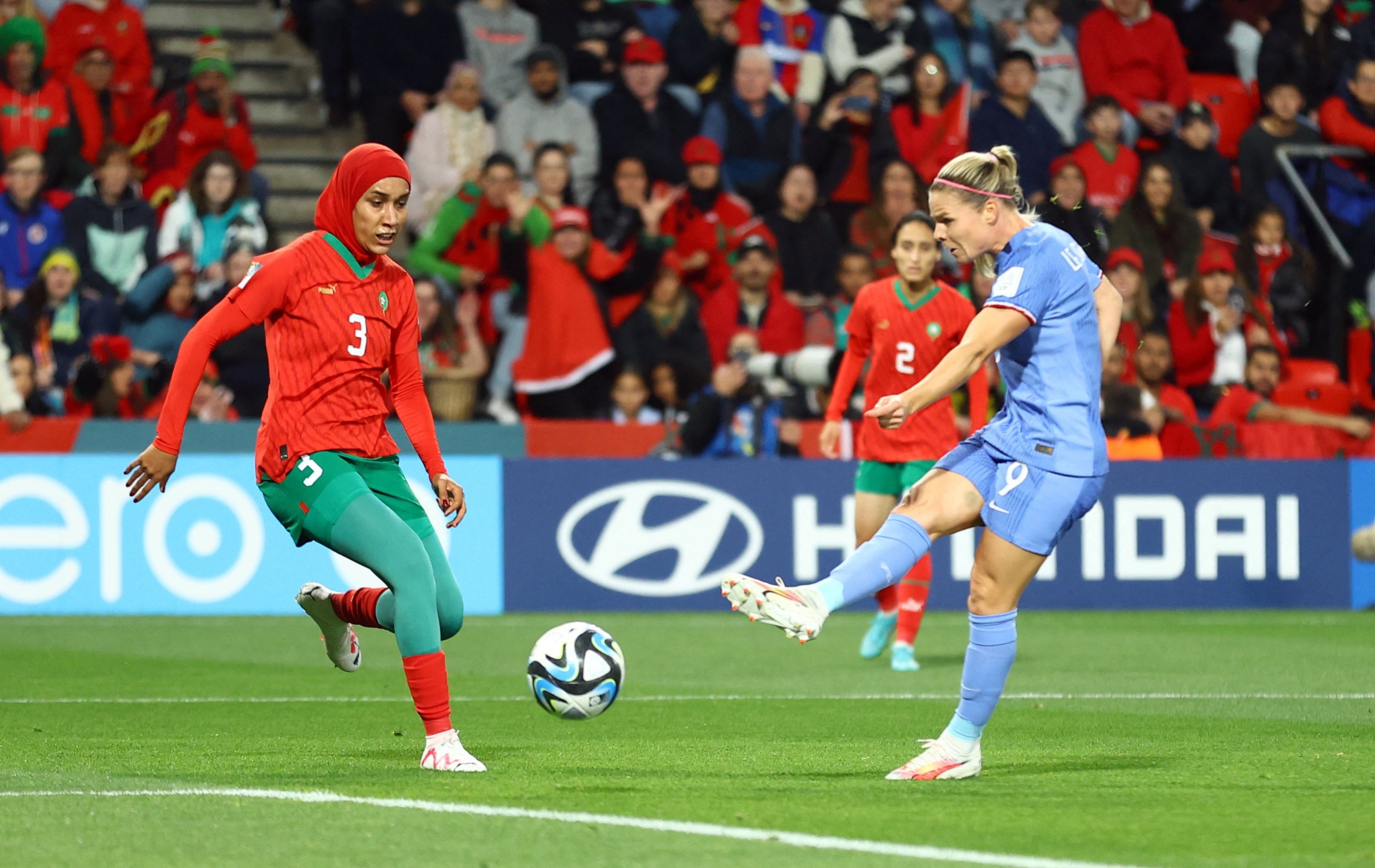 286506 France's Eugenie Le Sommer (R) scores their third goal past Morocco's Nouhaila Benzina during the Women’s World Cup round of 16 match at the Hindmarsh Stadium, Adelaide, Australia, Aug. 8, 2023. (Reuters Photo)