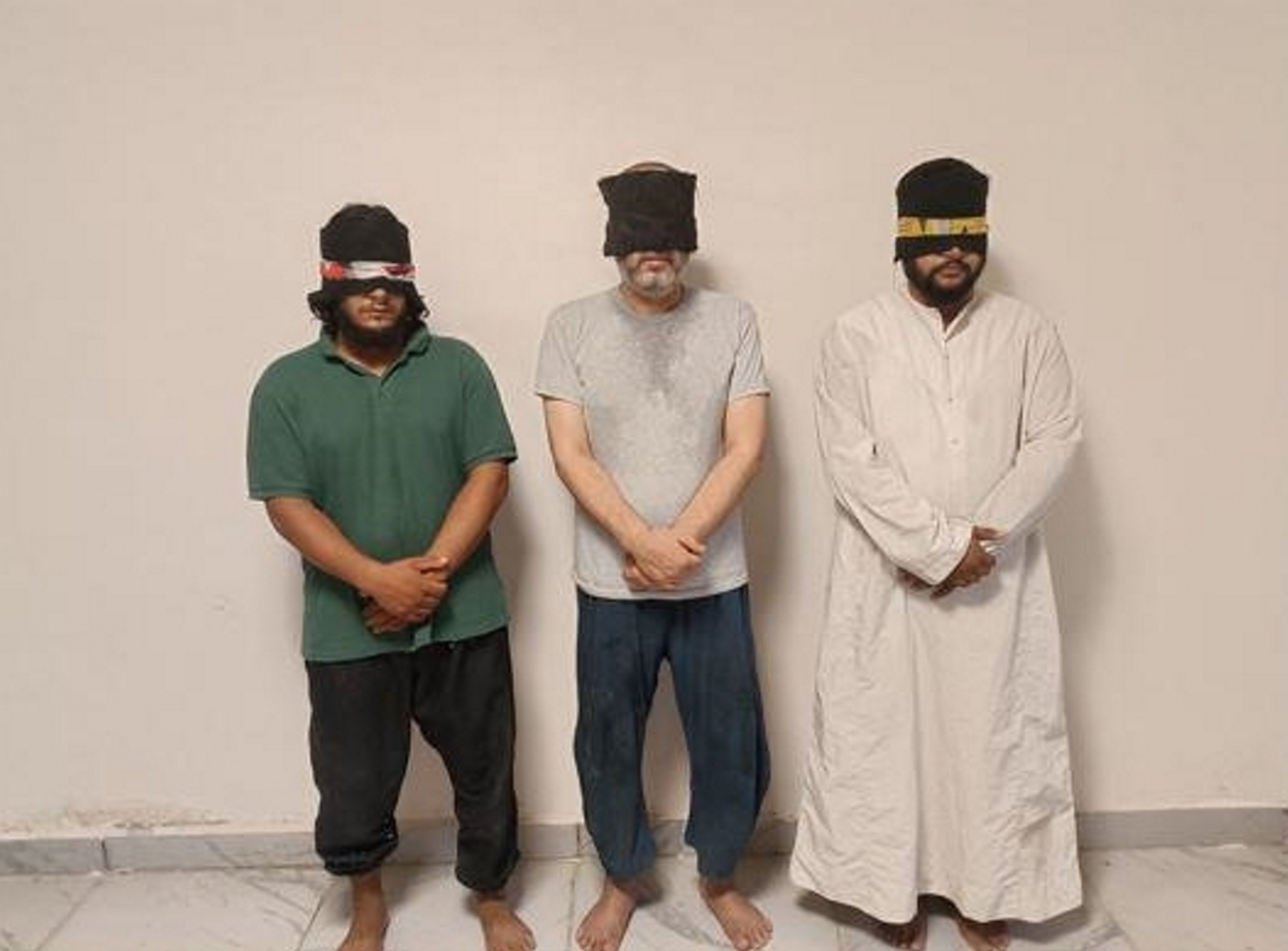 286790 A handout photo from Türkiye’s National Intelligence Organization (MIT) shows three Daesh terrorists standing against a wall following their capture during an operation in northern Syria, Aug. 10, 2023. (AA Photo)