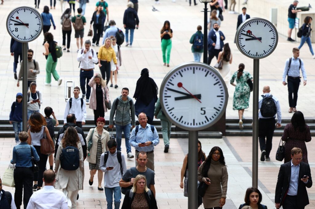 Workers walk through the Canary Wharf financial district in London, Britain, Aug. 3, 2023. (Reuters Photo)