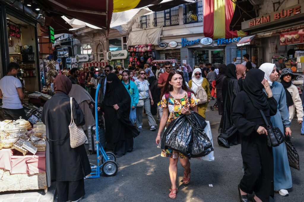 People shop at the old city bazaar in Istanbul, Türkiye, Aug. 3, 2023. (EPA Photo)