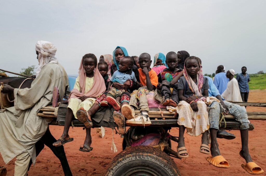 Sudanese refugee children ride a cart while crossing the border between Sudan and Chad, Adre, Chad, Aug. 4, 2023. (Reuters Photo)