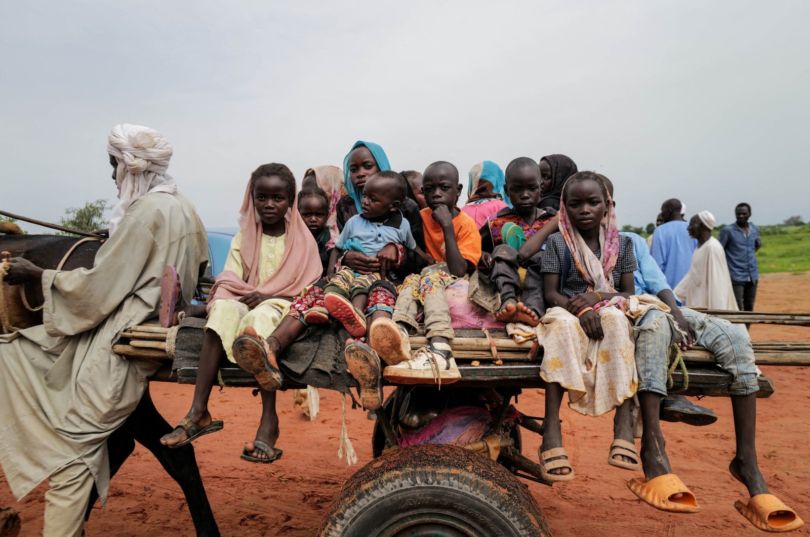 Sudanese refugee children ride a cart while crossing the border between Sudan and Chad, Adre, Chad, Aug. 4, 2023. (Reuters Photo)