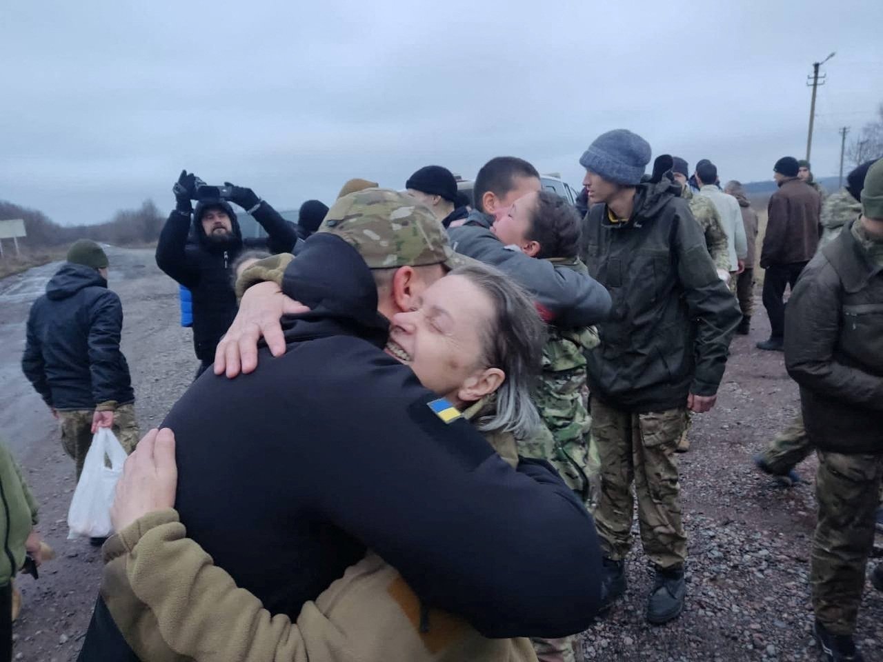 A woman embraces a Ukrainian prisoner of war after a swap, amid Russia's attack on Ukraine in an undisclosed location, Ukraine, Dec. 31, 2022. (Reuters Photo)