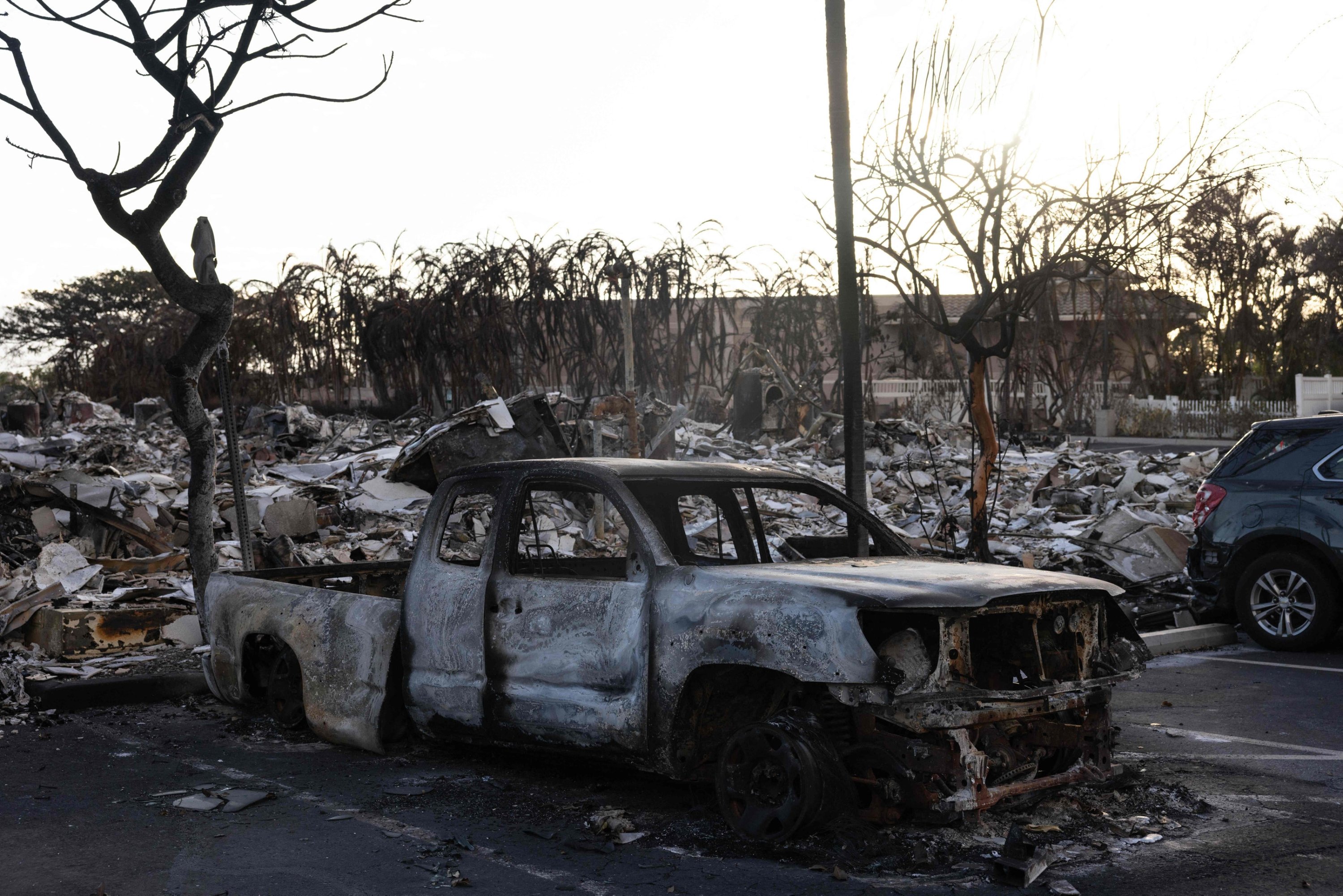 287183 A burnt out car lies in the driveway of charred apartment complex in the aftermath of a wildfire in Lahaina, western Maui, Hawaii, U.S., Aug. 12, 2023. (AFP Photo)