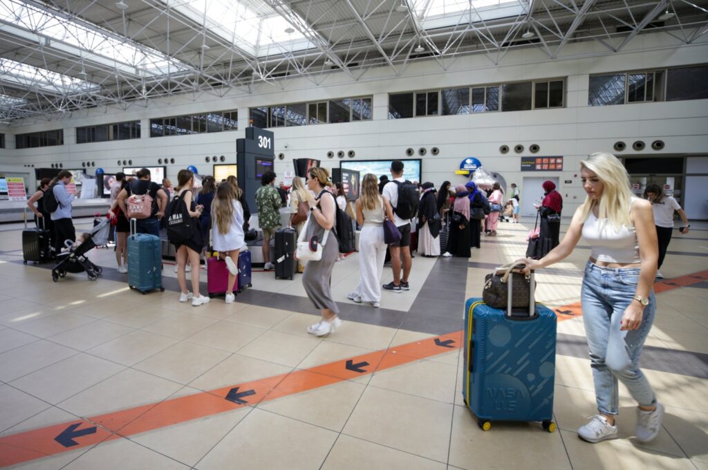 Tourists are seen at the airport in the Mediterranean tourism hot spot Antalya, southern Türkiye, Aug. 8, 2023. (AA Photo)