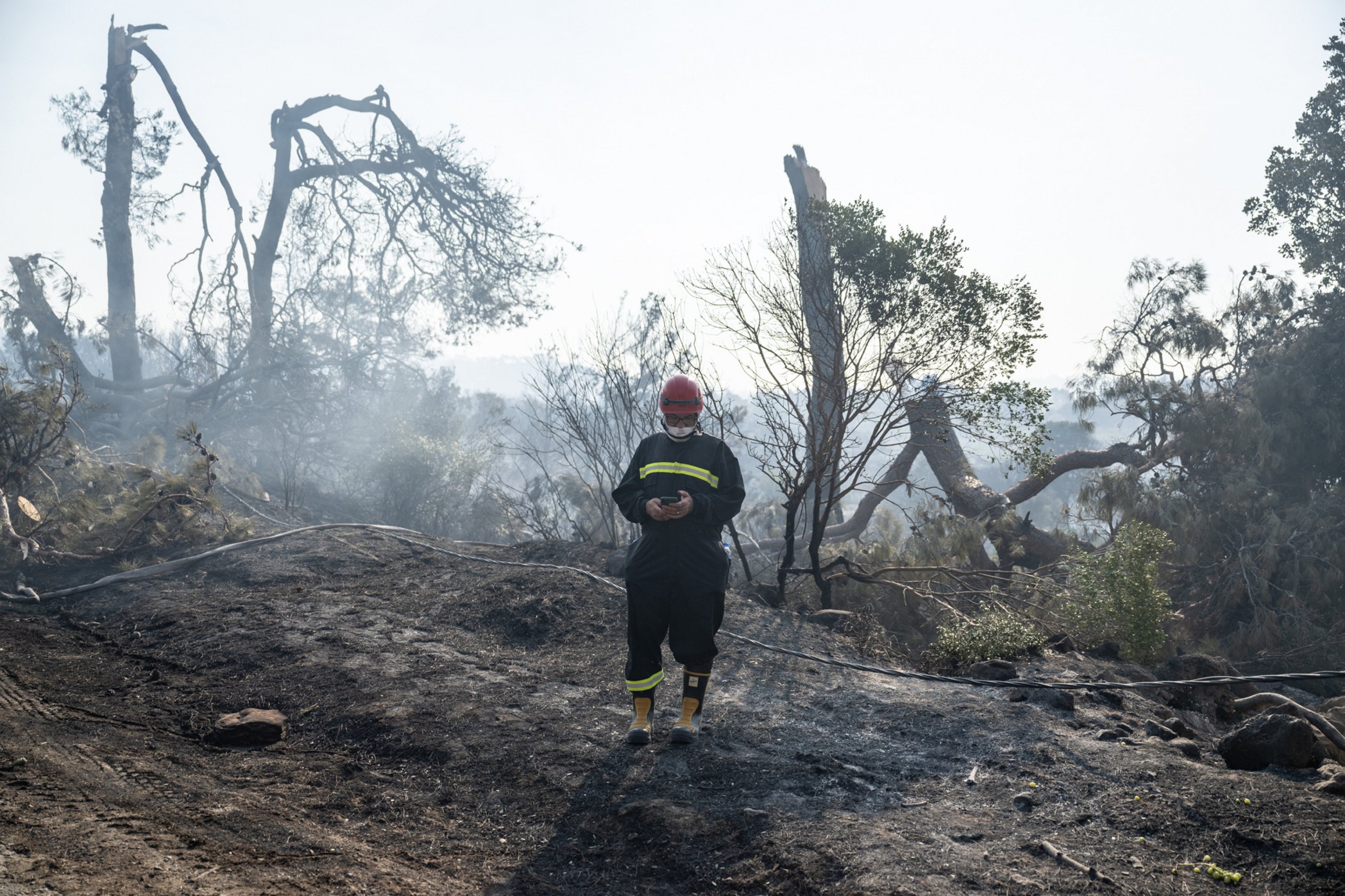 288707 A firefighter is seen in the forest area near the Ulupınar village, Çanakkale, Türkiye, Aug. 23, 2023. (AA Photo)