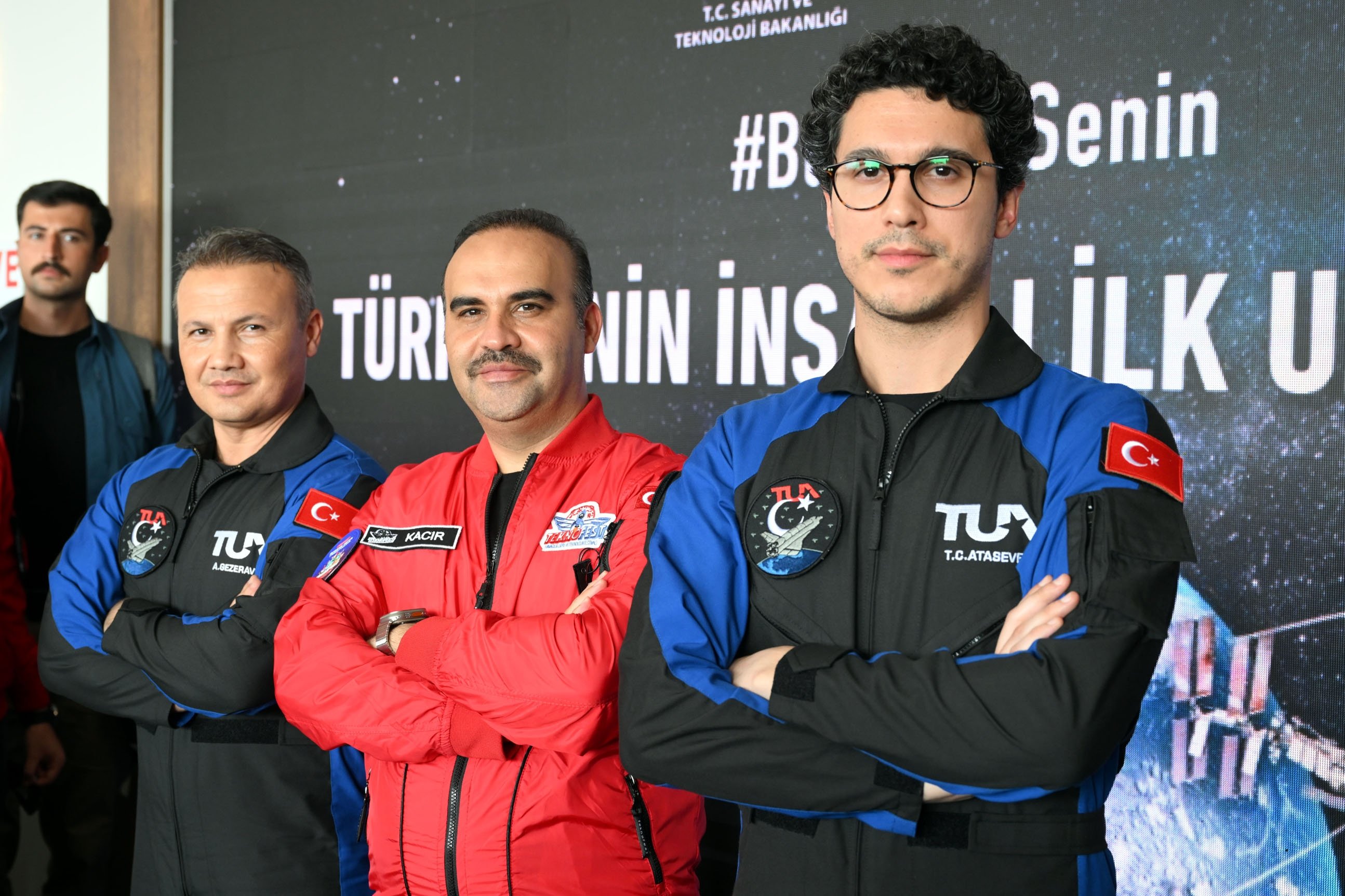 290259 Industry and Technology Minister Mehmet Fatih Kacır (C) poses next to Türkiye's first space travelers Alper Gezeravcı (L) and Tuva Cihangir Atasever in Ankara, Türkiye, Sept. 2, 2023. (DHA Photo)