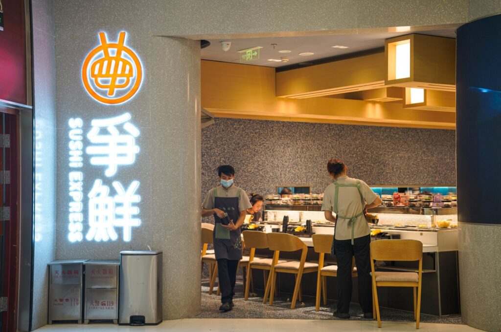 The staff work in a Japanese sushi restaurant in Beijing, China, Aug. 28, 2023. (EPA Photo)