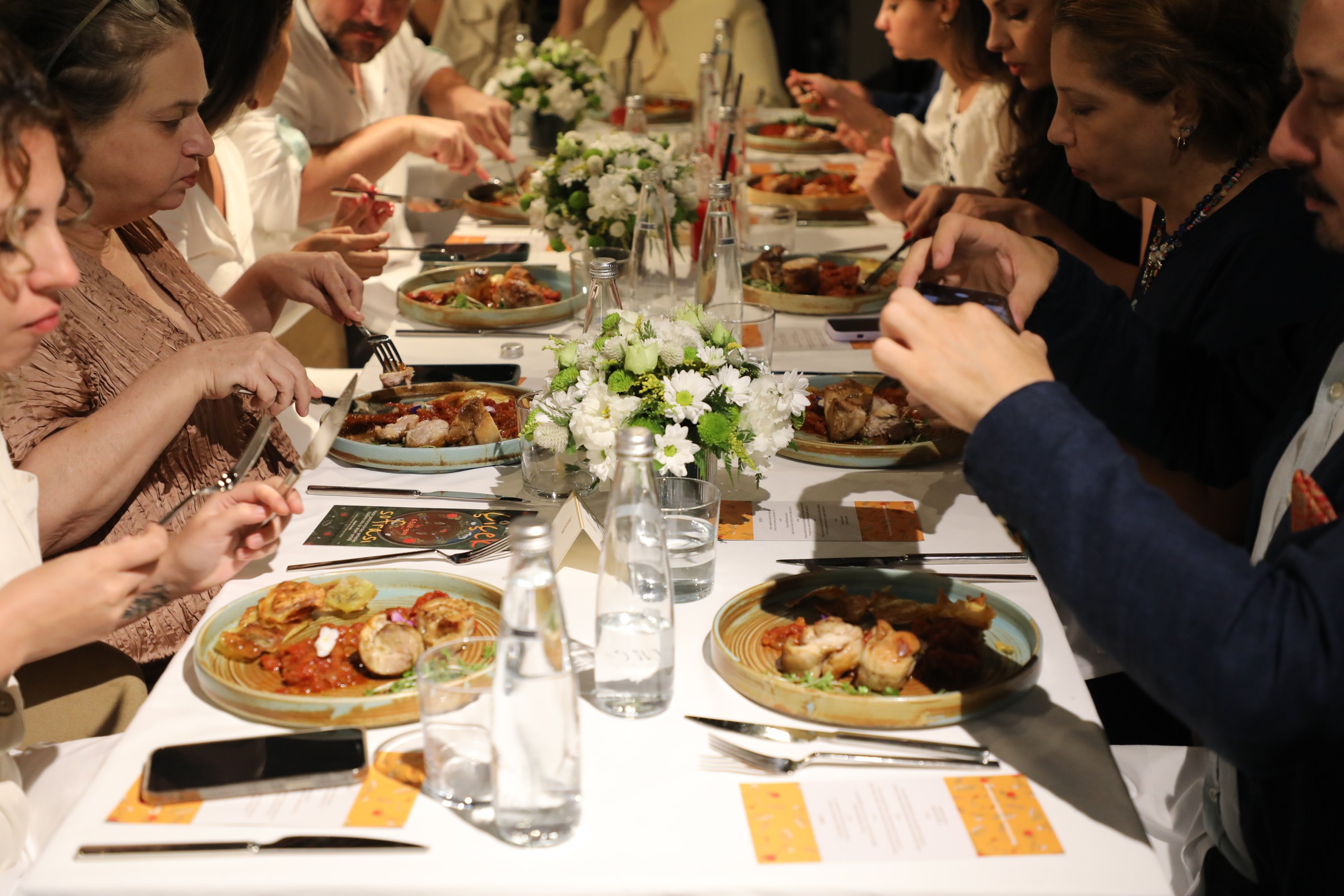 291069 The visitors taste the dishes at the 'Dinner of Flowers,' Istanbul, Türkiye, Sept. 6, 2023. (Photo by Emre Topdemir)