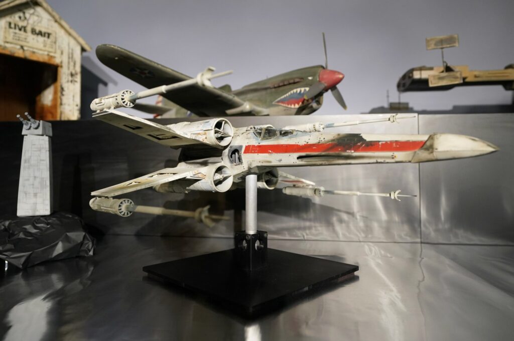 A miniature model called "Red Leader", a X-wing starfighter from the 1977 film, Star War, Episode IV, A New Hope, on display at Heritage Auctions, in Irving, Texas, U.S., Aug. 30, 2023. (AP Photo)