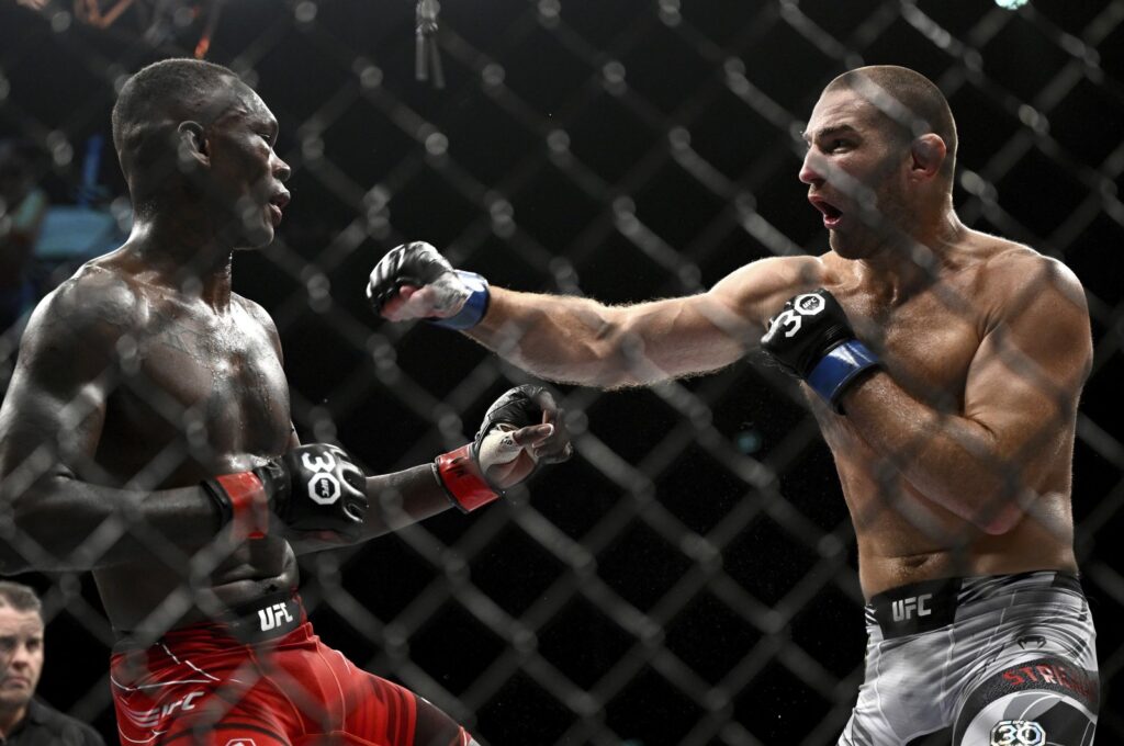 American Sean Strickland (R) and Nigerian-born New Zealander Israel Adesanya battle in the middleweight title bout at UFC 293 in Sydney, Australia, Sept. 10, 2023. (AP Photo)