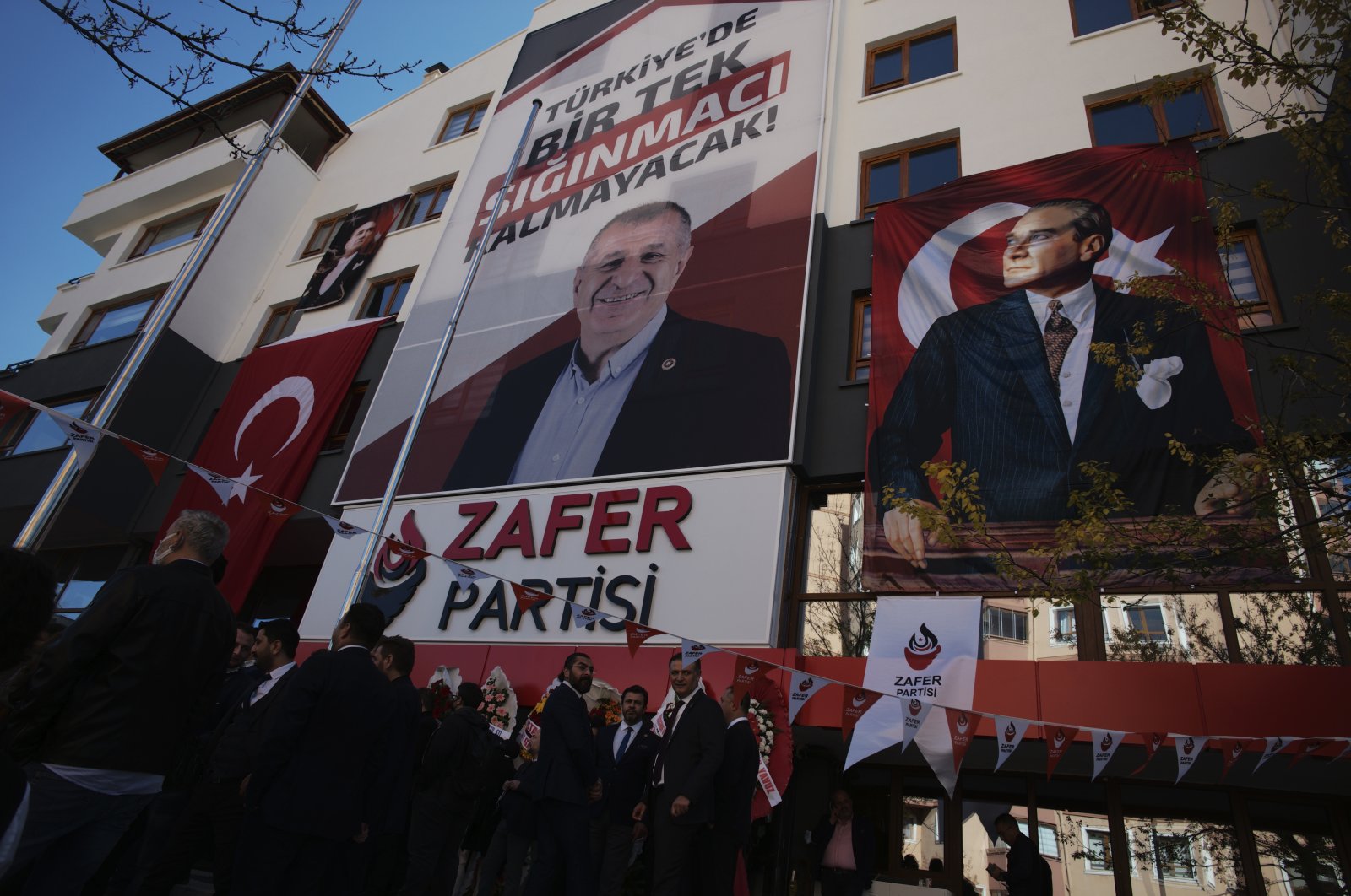 A banner reading "Not a single asylum-seeker will remain in Türkiye!" displayed at the headquarters of the anti-refugee Victory Party, above the photo of party's chair Ümit Özdağ, in the capital Ankara, Türkiye, November 6, 2021. (AP Photo)