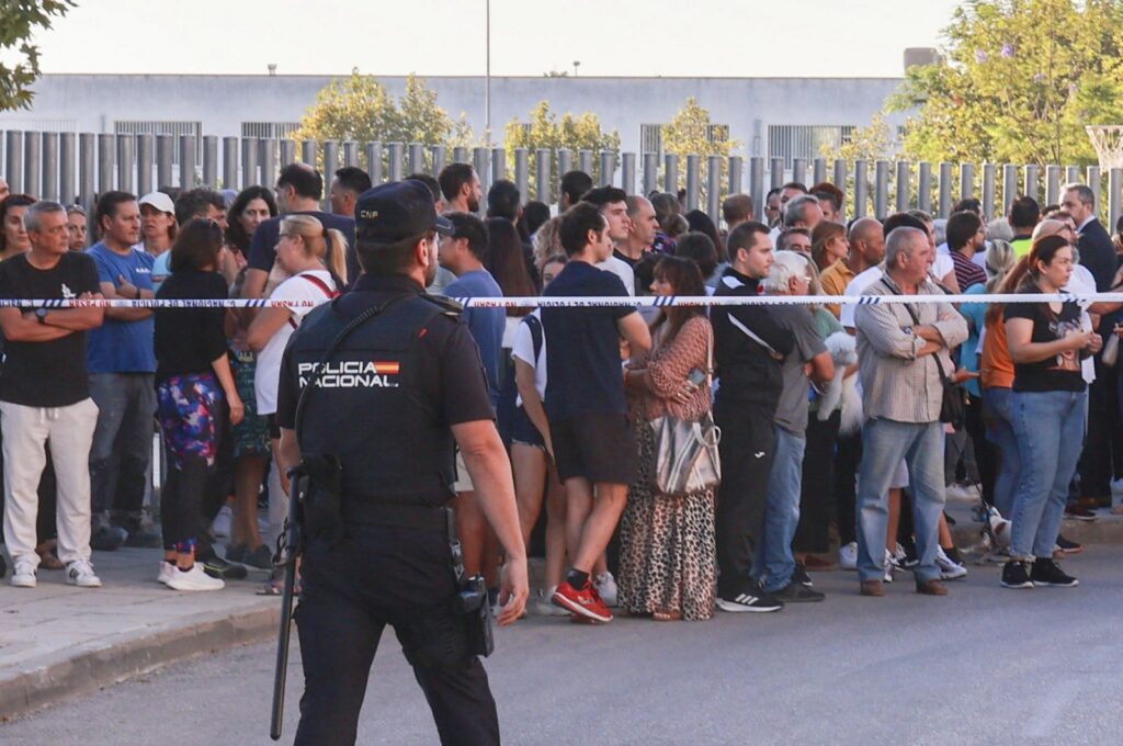 People stand outside the Elena Garcia Armada High School after it was evacuated following a knife attack carried out by a student, in Jerez de la Frontera, southern Spain, Sept. 28, 2023. (EPA Photo)