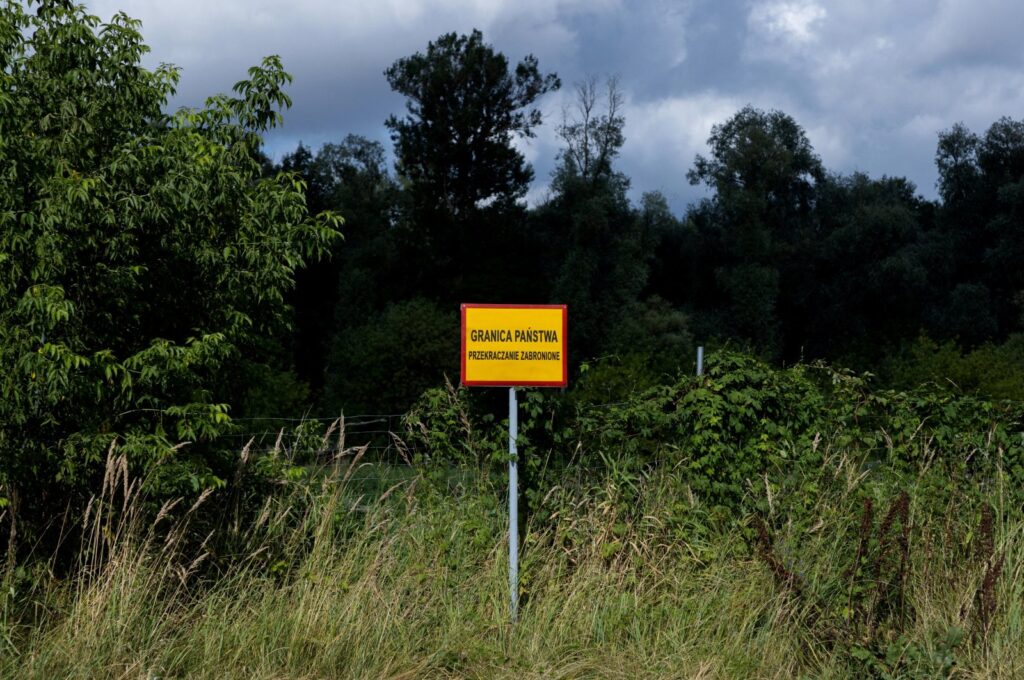A sign reading "State border. Crossing prohibited" is seen near the Bug River at the Poland-Belarus border, near Kostomloty, Poland, July 20, 2023. (Reuters Photo)