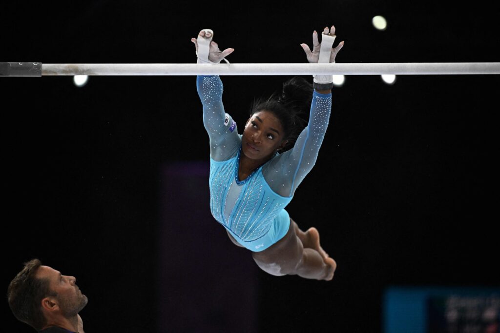 TOPSHOT - US' Simone Biles competes in the uneven bars during the women's qualifying session at the 52nd FIG Artistic Gymnastics World Championships, Antwerp, Belgium, Oct. 1, 2023. (AFP Photo)