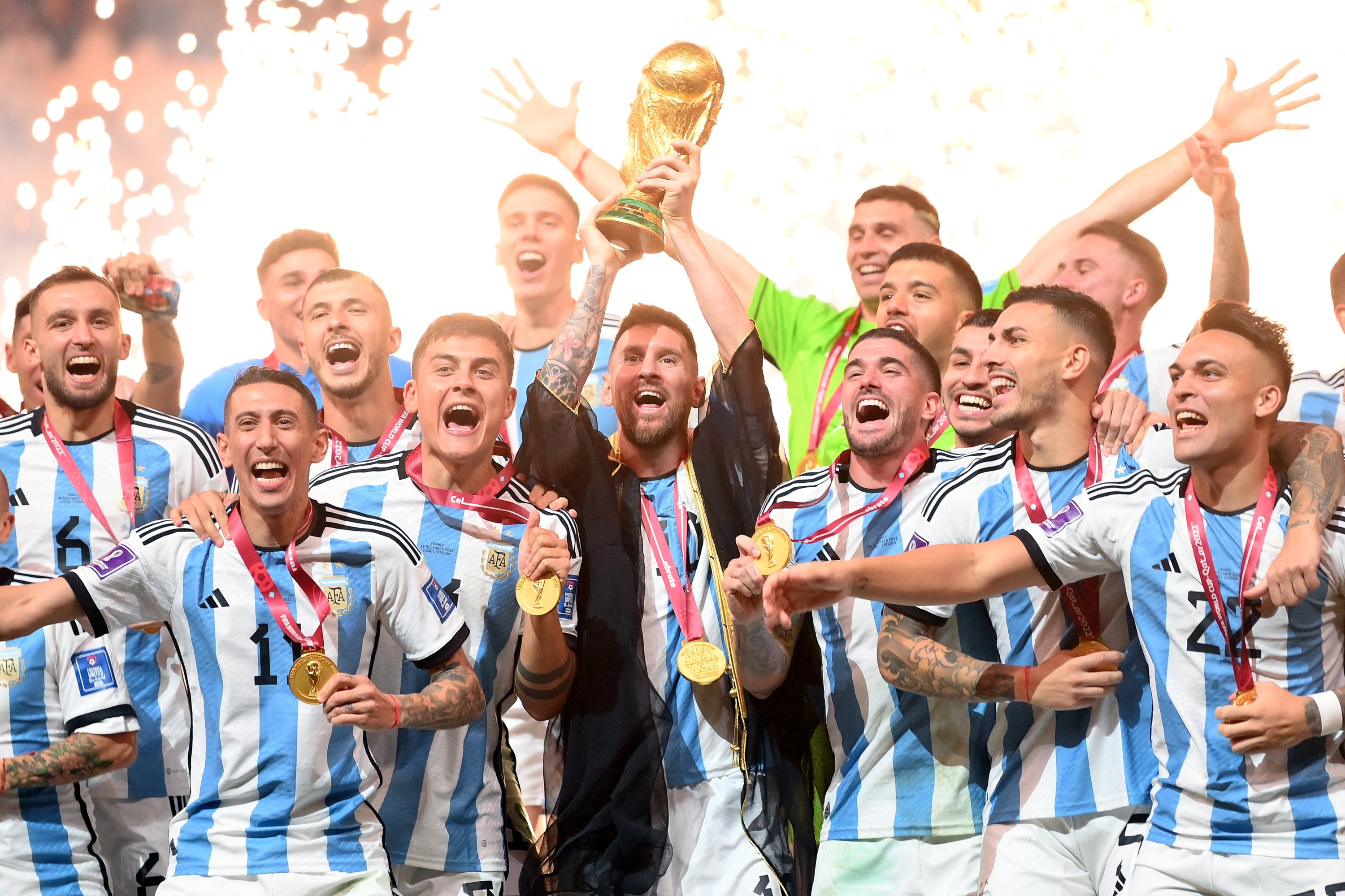 295334 Argentina's Lionel Messi (C) lifts the FIFA World Cup Qatar 2022 Winner's Trophy following the FIFA World Cup Qatar 2022 Final match between Argentina and France at Lusail Stadium, Lusail City, Qatar, Dec. 18, 2022. (Getty Images Photo)