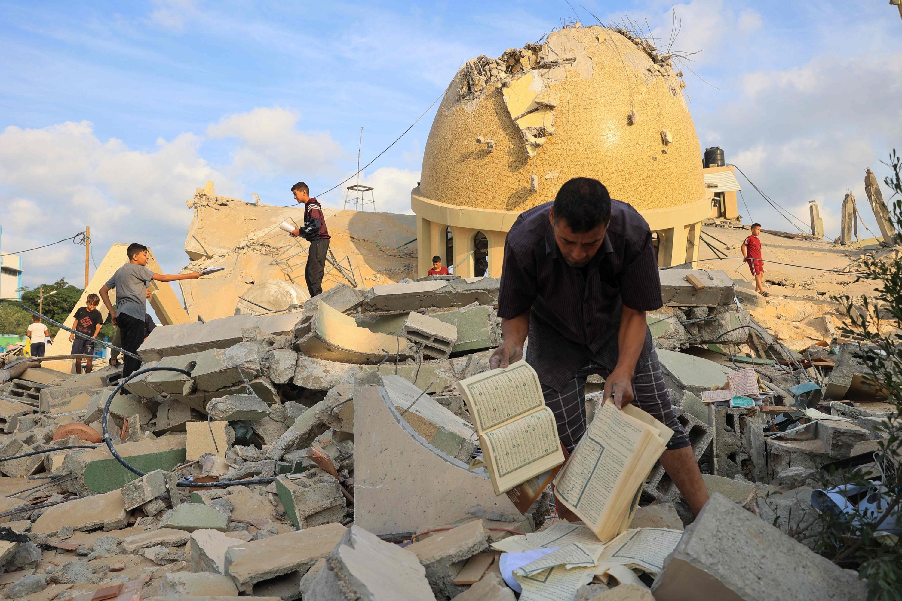 295722 People examine the ruins of a mosque destroyed in Israeli airstrikes in Khan Yunis, southern Gaza Strip, Palestine, Oct. 8, 2023. (AFP Photo)