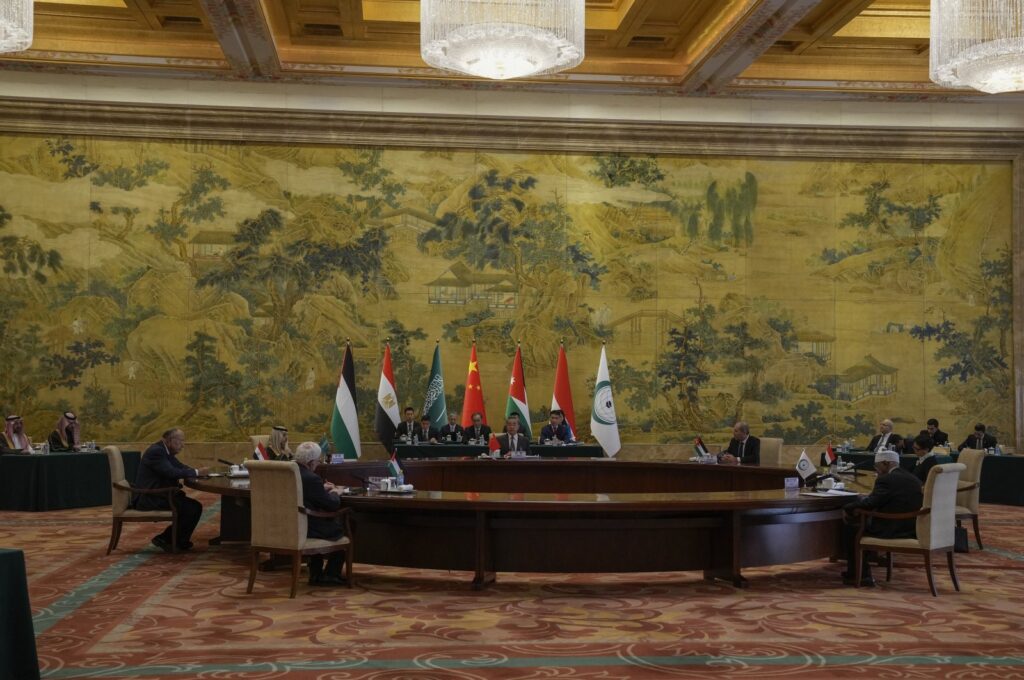 Chinese Foreign Minister Wang Yi (C) speaks during a round table meeting with five Arab and Islamic counterparts from center clock wise, Jordanian Deputy Prime Minister and Foreign Minister Ayman Safadi, Indonesian Foreign Minister Retno Marsudi, Secretary-General of the Organization of Islamic Cooperation (OIC) Hissein Brahim Taha, Palestine Foreign Minister Riyad al-Maliki, Egyptian Foreign Minister Sameh Shoukry and Saudi Arabia's Foreign Minister Faisal bin Farhan Al Saud at the Diaoyutai state guesthouse in Beijing, China, Nov. 20, 2023. (AP Photo)