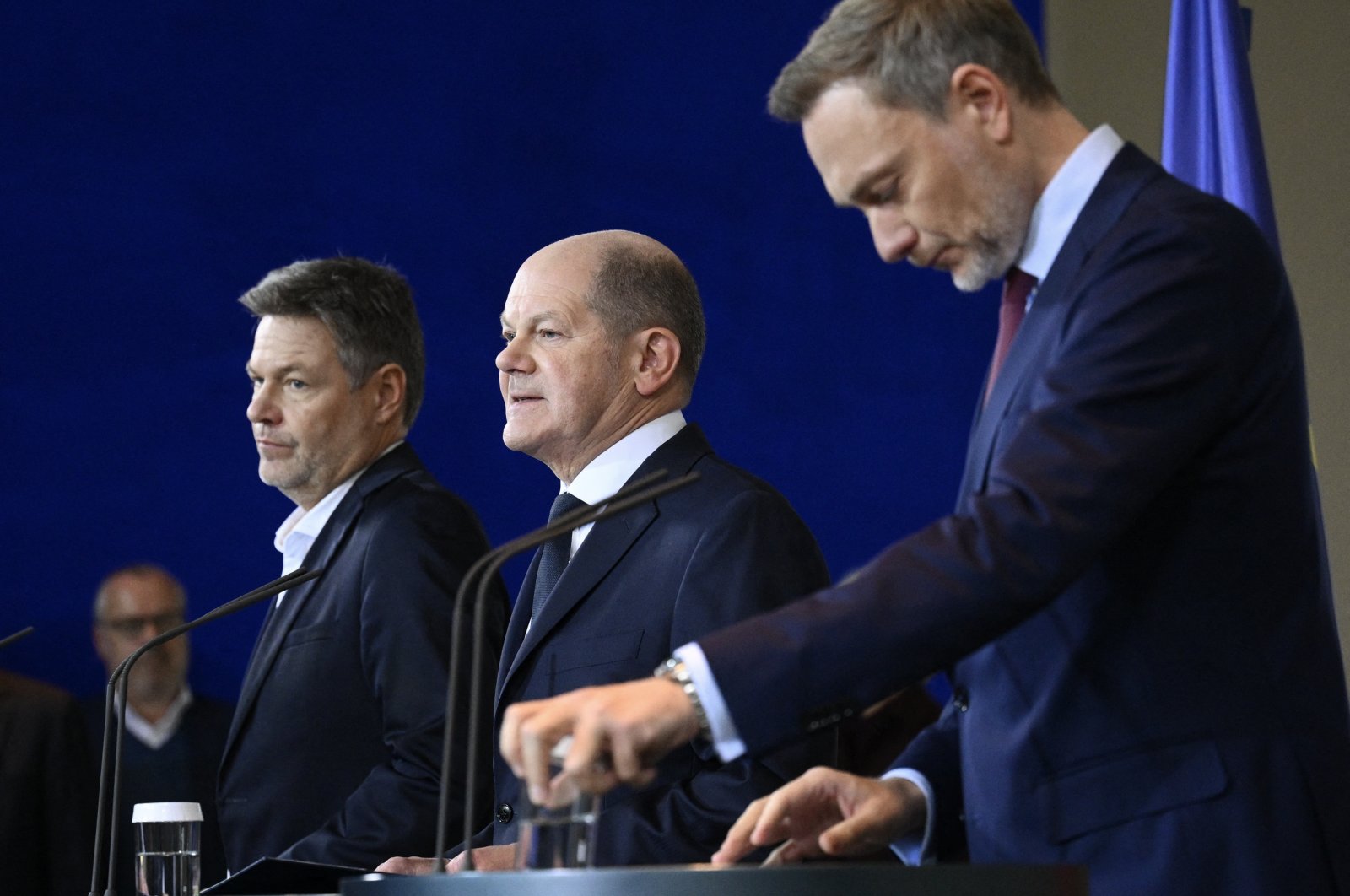 German Chancellor Olaf Scholz (C) is flanked by Economy and Climate Minister Robert Habeck (L) and Finance Minister Christian Lindner to comment on the ruling of Germany's Constitutional court that the government's re-location of 60 billion euros ($65 billion) of unused debt from the pandemic era to climate fund was illegal, Berlin, Germany, Nov. 15, 2023. (Reuters Photo)
