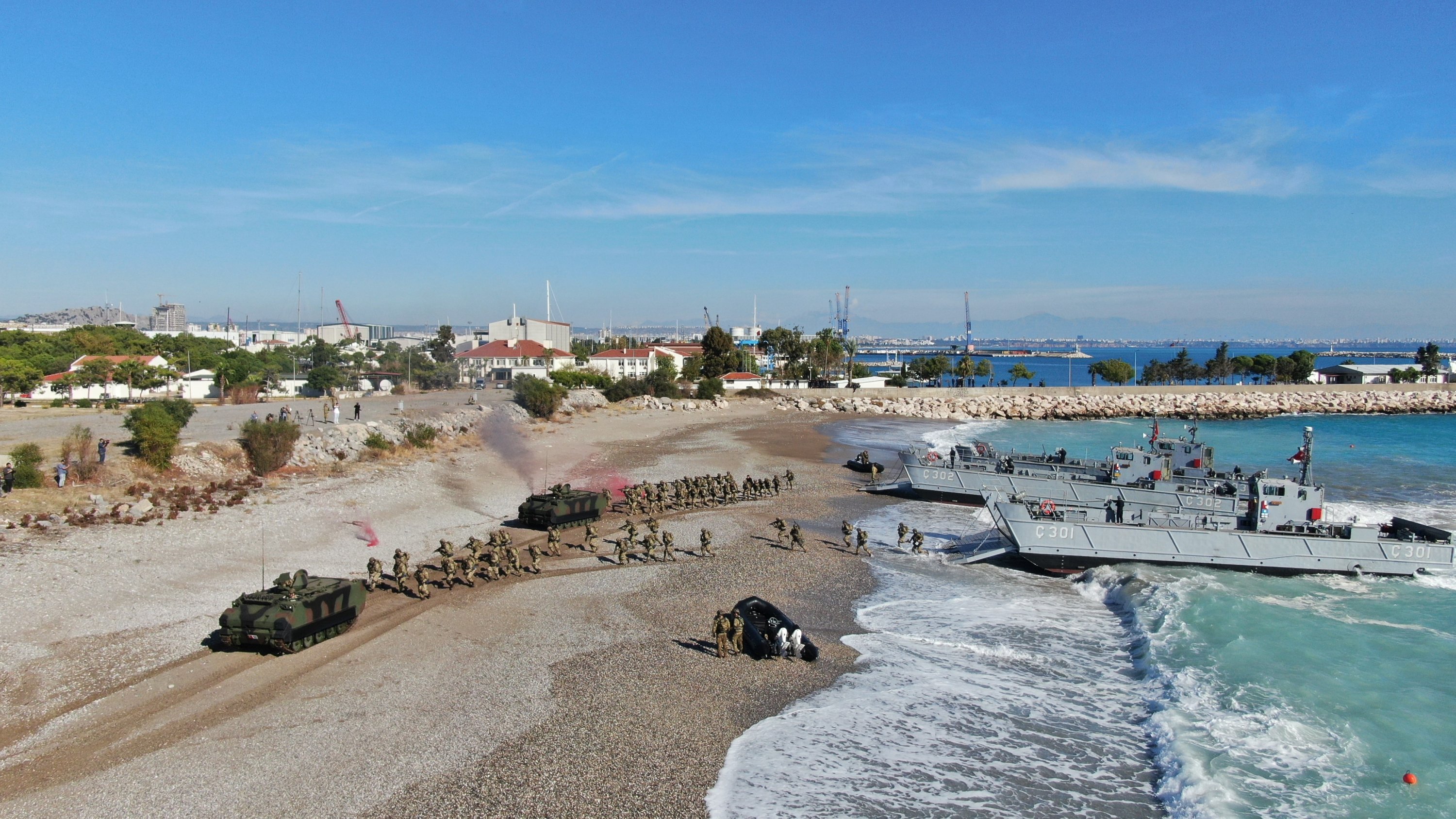 302492 Turkish amphibian infantry forces and tanks land on the shores of Konyaaltı district in southern Antalya province, Türkiye, Nov. 23, 2023. (IHA Photo)