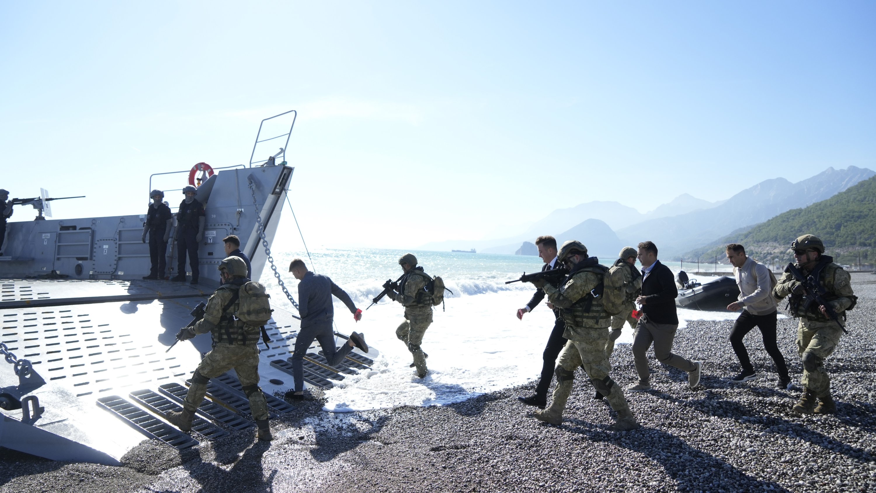 302493 Turkish amphibian infantry forces rescue civilian victims of an earthquake scenario as part of the Eastern Mediterranean-2023 Exercise on the shores of Konyaaltı district in southern Antalya province, Türkiye, Nov. 23, 2023. (IHA Photo)