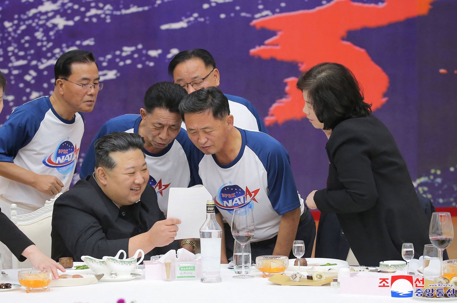 North Korea's leader Kim Jong Un (2nd L) chatting with senior officials of relevant departments at a banquet to celebrate the launch of a spy satellite, Pyongyang, North Korea, Nov. 23, 2023. (AFP Photo)