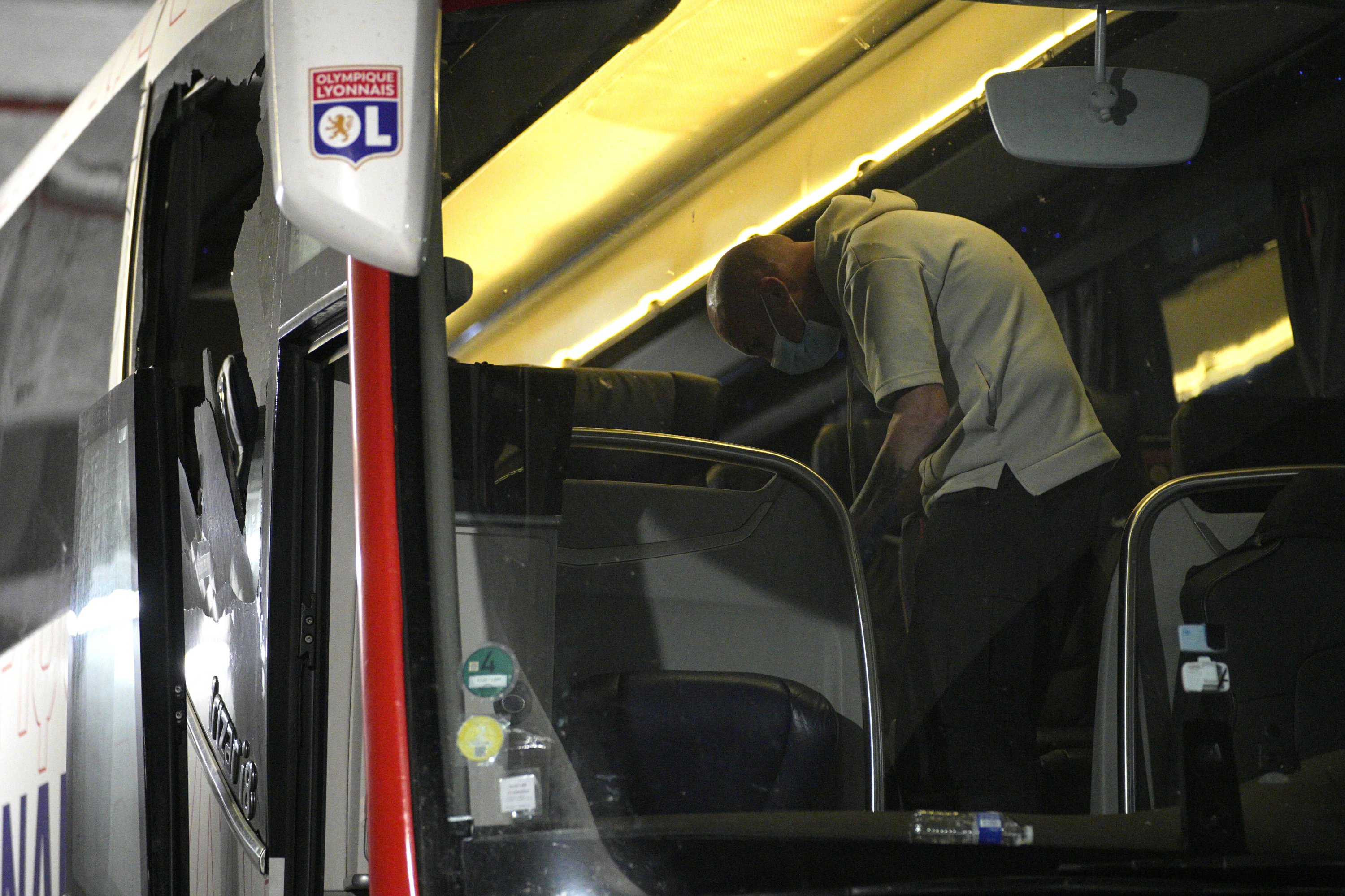 303530 Police take finger prints in a bus that the Lyon team were traveling in, before arriving at the Velodrome Stadium prior to the French Ligue 1 match against Marseille at the Velodrome Stadium, Marseille, France, Oct. 29, 2023. (AP Photo)