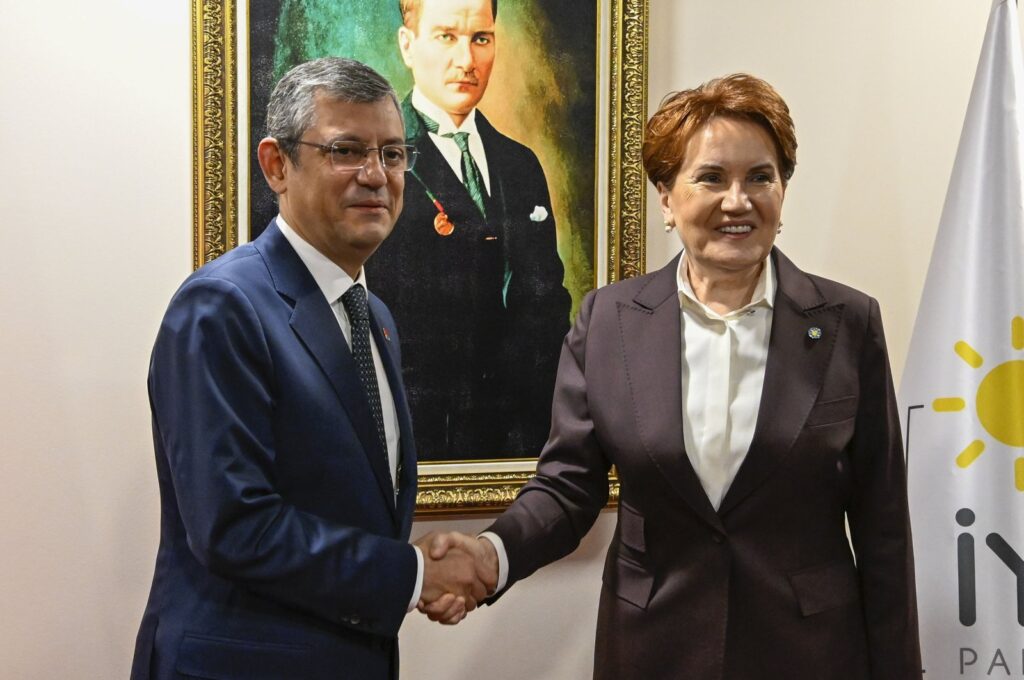 Republican People's Party (CHP) Chair Özgür Özel (L) shakes hands with Good Party (IP) leader Meral Akşener ahead of their meeting at IP headquarters in Ankara, Türkiye, Nov. 30, 2023. (AA Photo)
