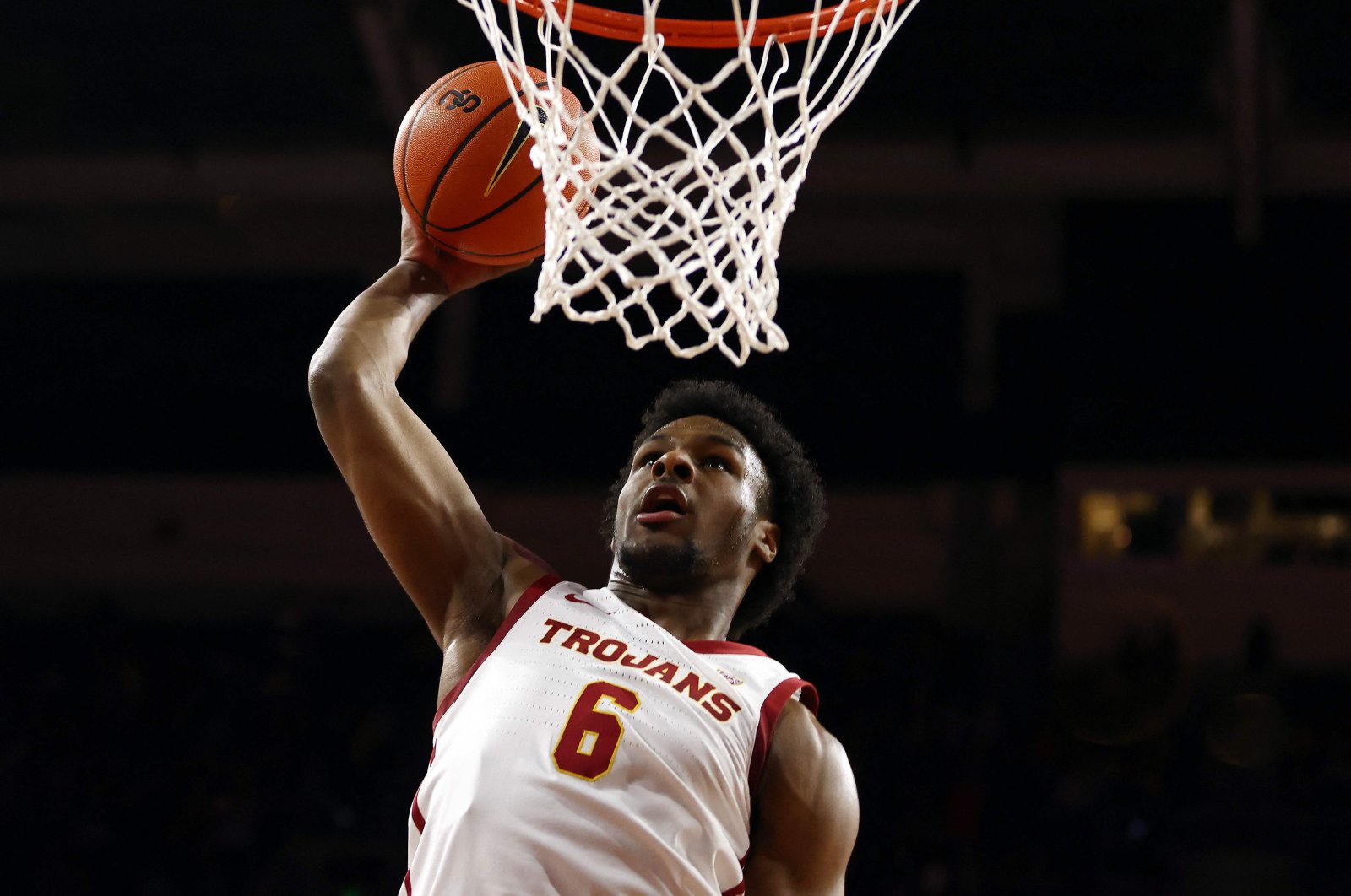 Bronny James #6 of the USC Trojans dunks the ball during warm ups prior to the SEC Championship game against the Long Beach State 49ers at Galen Center on, in Los Angeles, California, U.S., Dec. 10, 2023. (AFP Photo)