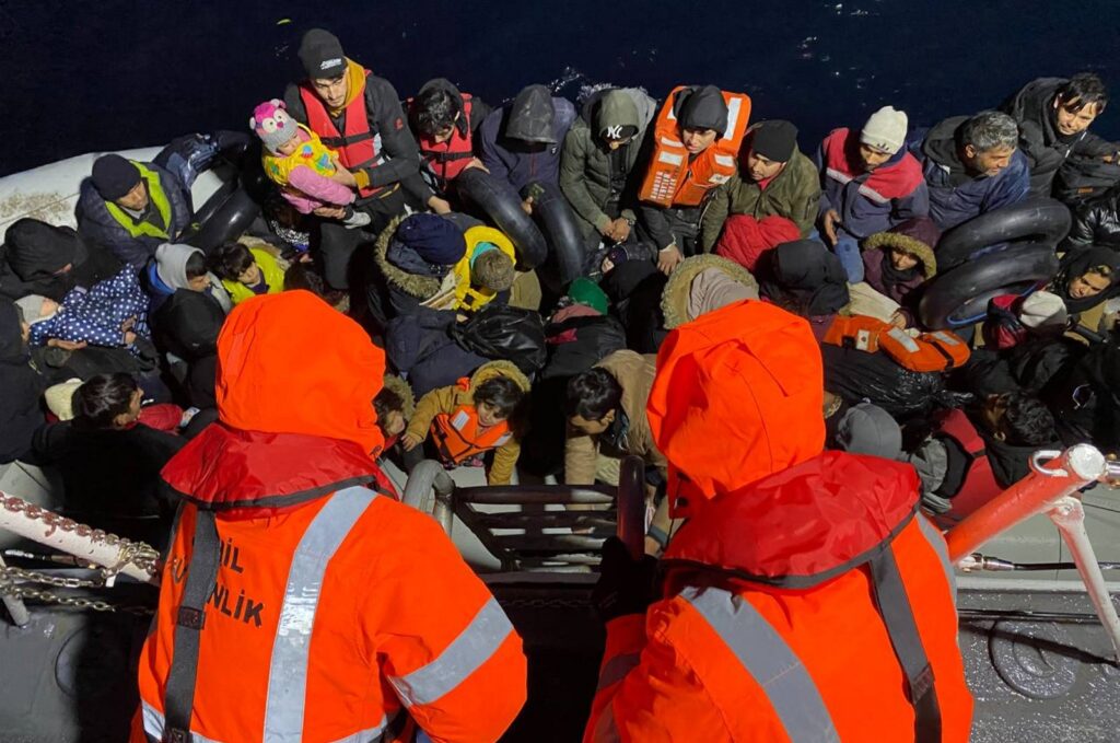 Turkish Coast Guard Command pulls up to rescue a group of 58 irregular migrants on a rubber boat pushed back by Greece, off the coast of Izmir province, Türkiye, Dec. 12, 2023. (AA Photo)