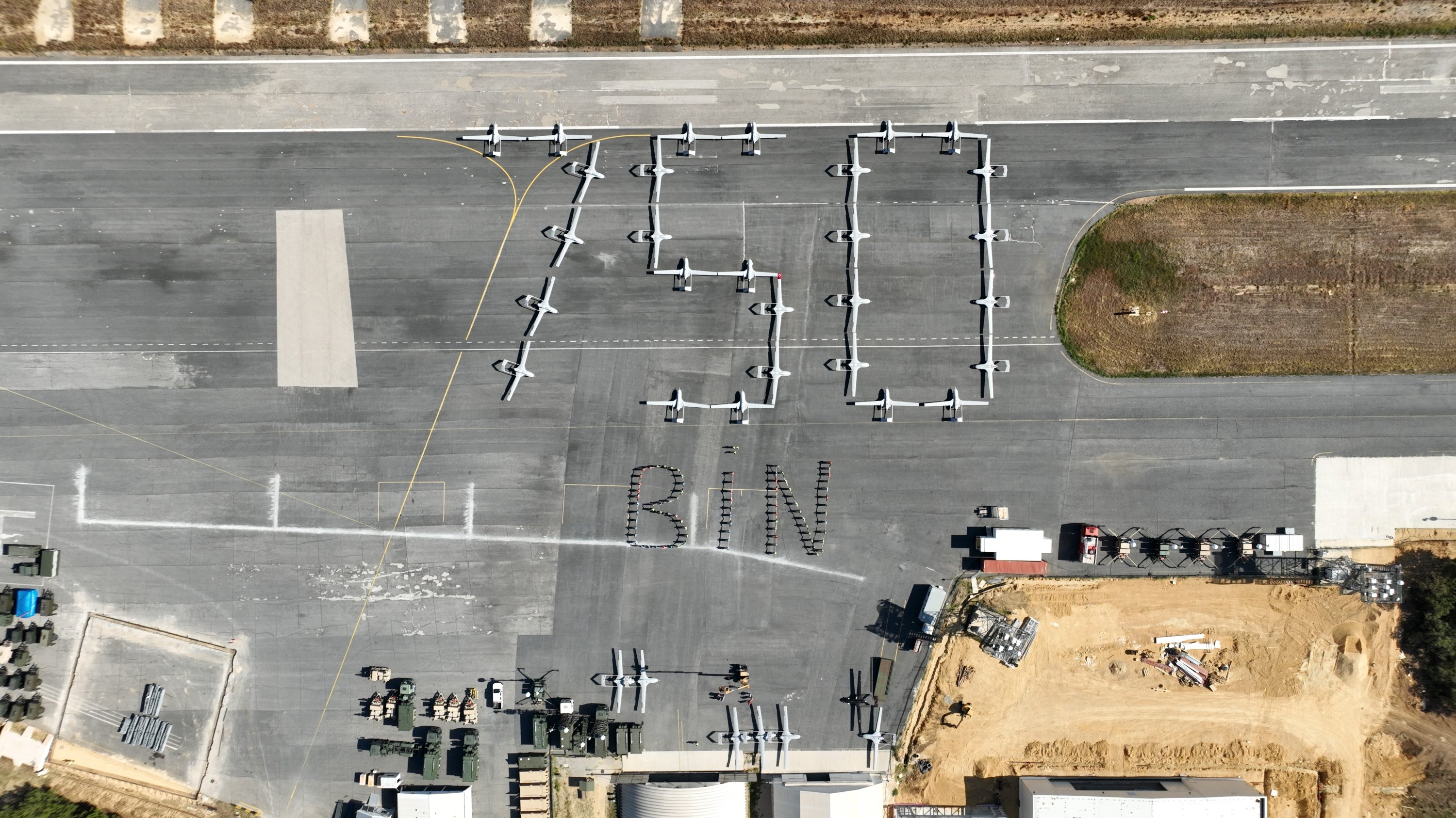 305168 Aerial view of Bayaktar TB2s developed by defense firm Baykar, arranged to symbolically mark 750,000 hours spent in the air, Istanbul, Türkiye, Dec. 11, 2023. (IHA Photo)