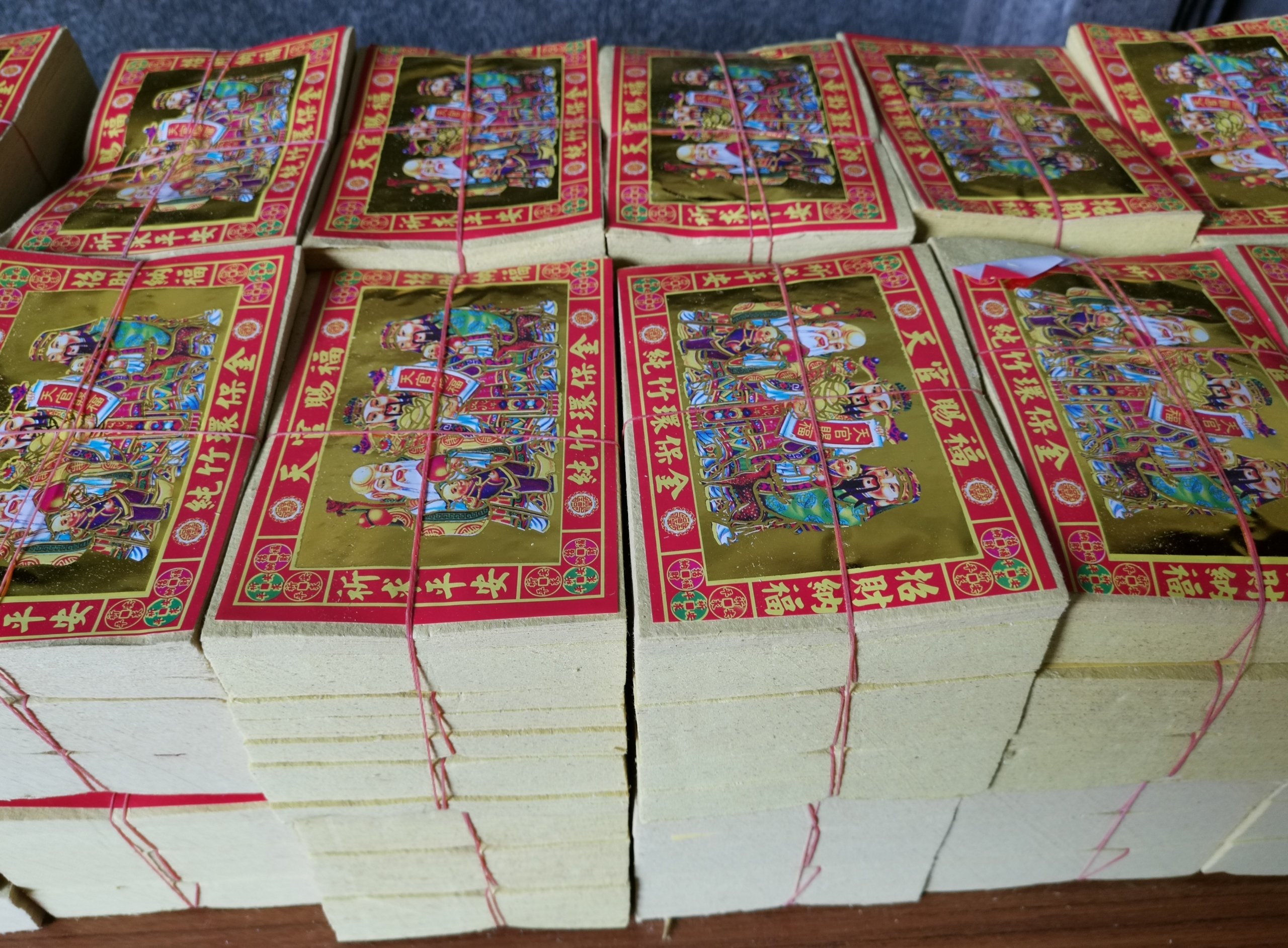 306850 Paper money available for purchase at a temple. Burning it is said to help provide for your ancestors. (dpa Photo)