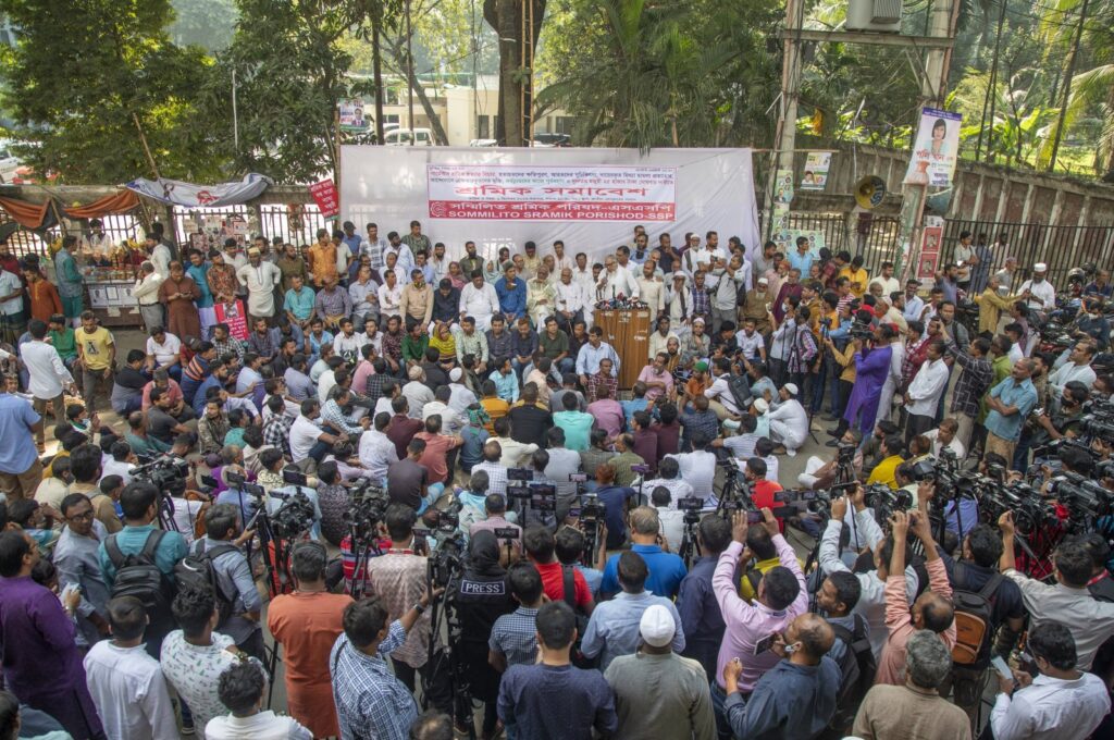 Garment workers' union members hold placards and shout slogans as they take part in a protest to stress their six-point demand, including an increase in minimum wages, in front of the Press Club in Dhaka, Bangladesh, Dec. 1, 2023. (EPA Photo)