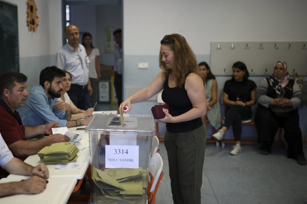 A woman casts her ballot at a polling station during local elections, in Istanbul, Türkiye, June 23, 2019. (AP Photo)