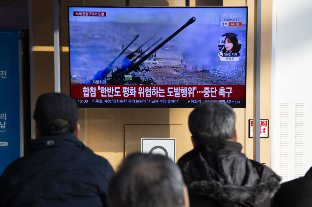 People watch the news of North Korea firing 200 artillery shells into waters off its western coast, on a TV at a station, Seoul, South Korea, Jan. 5, 2024. (EPA Photo)