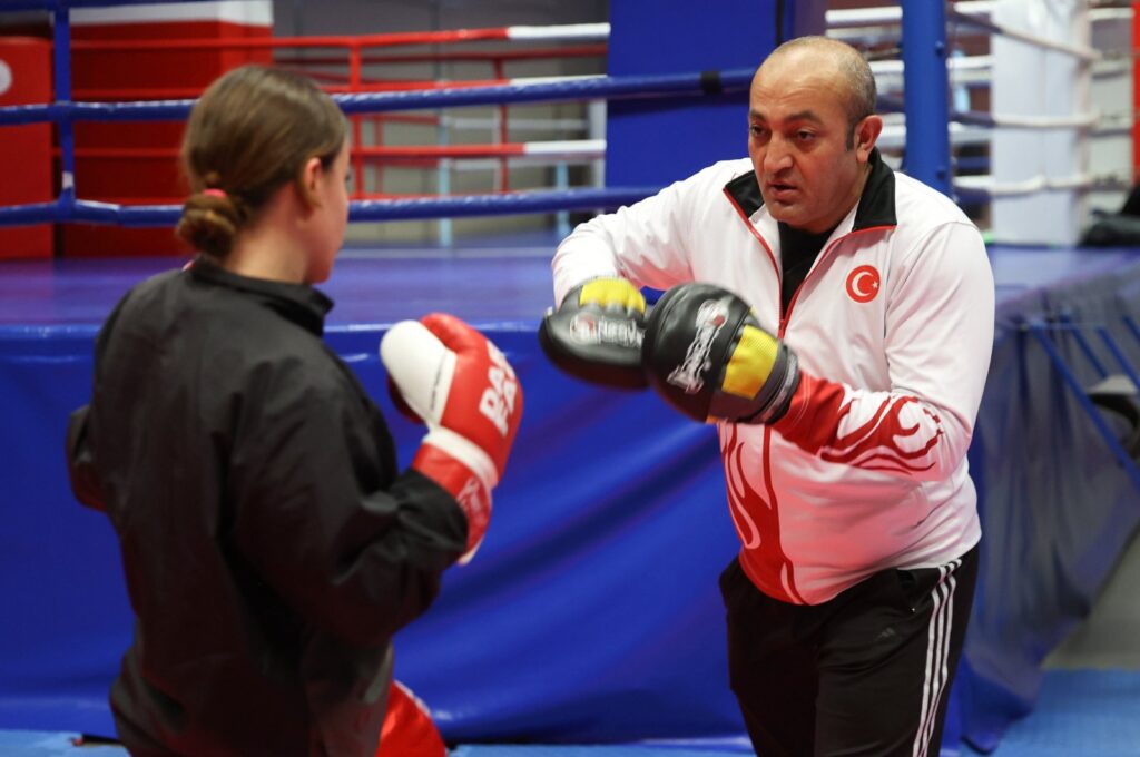 Kickboxing coach Esat Kaya, who began his fighting career in taekwondo secretly from his father, trains an athlete, Kayseri, Türkiye, Jan. 3, 2023. (AA Photo)