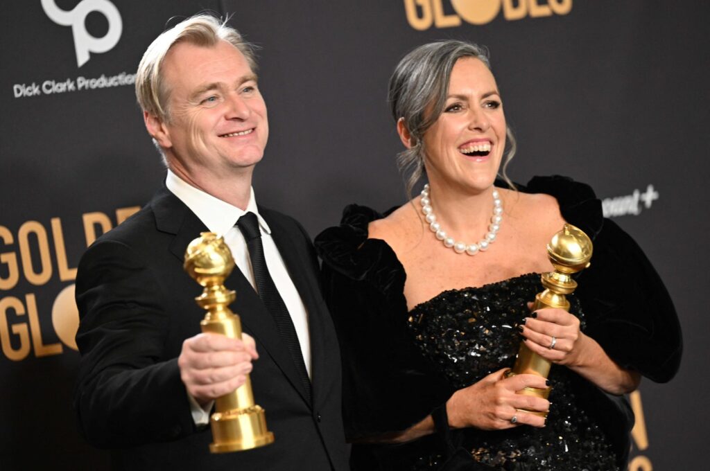 British director Christopher Nolan (L) and spouse British film producer Emma Thomas pose in the press room with the awards for Best Director - Motion Picture and Best Motion Picture - Drama for "Oppenheimer" during the 81st annual Golden Globe Awards, Beverly Hills, California, U.S., Jan. 7, 2024. (AFP Photo)