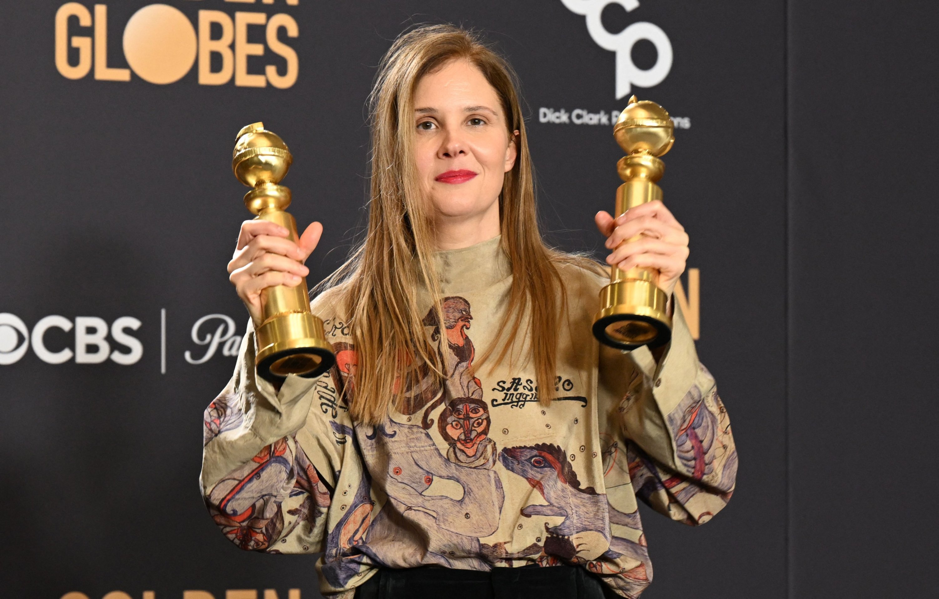 309069 French director Justine Triet poses with the awards for Best Screenplay - Motion Picture and Best Motion Picture - Non-English Language for