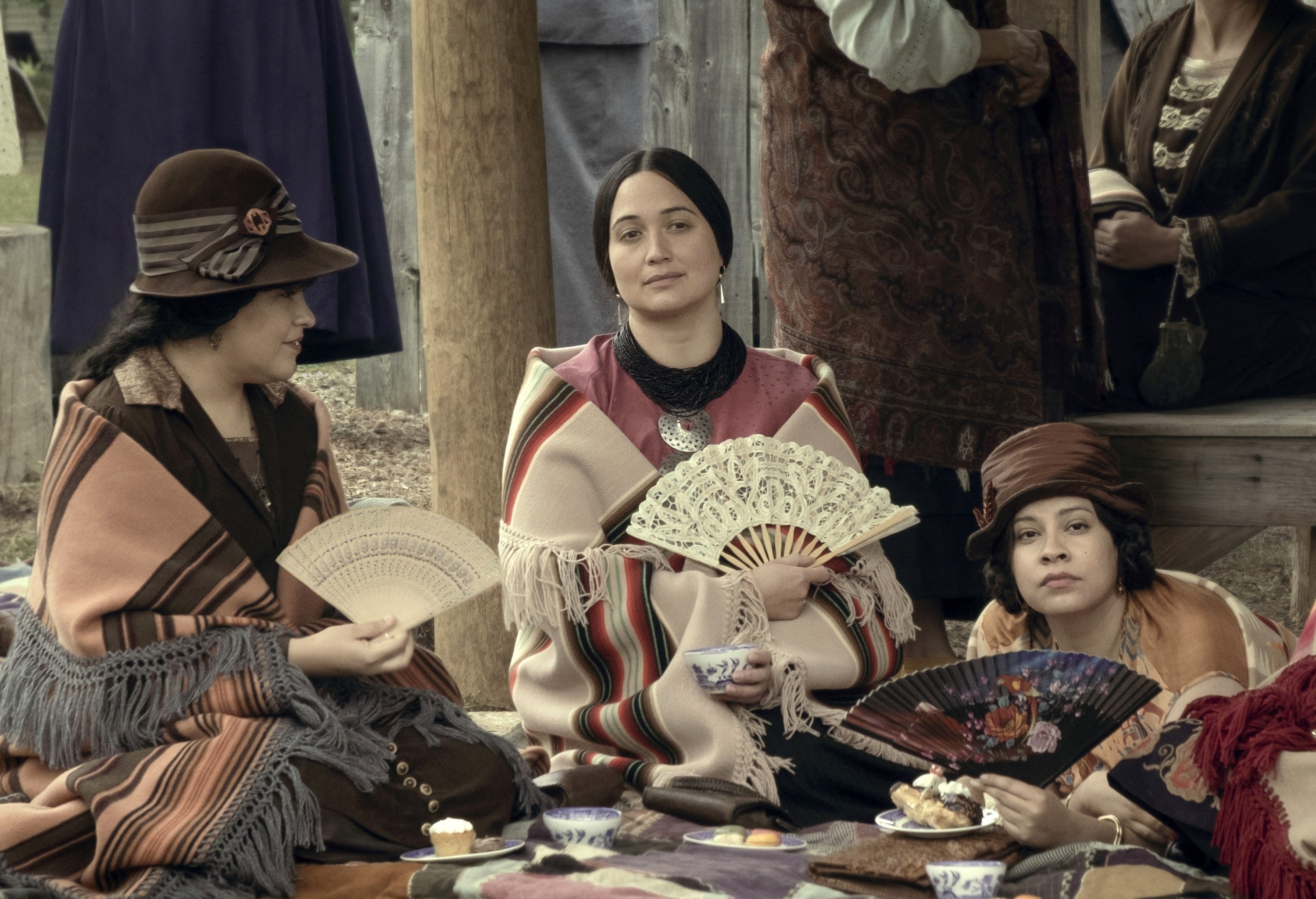 309084 This image shows (from left) JaNae Collins, Lily Gladstone and Cara Jade Myers in a scene from